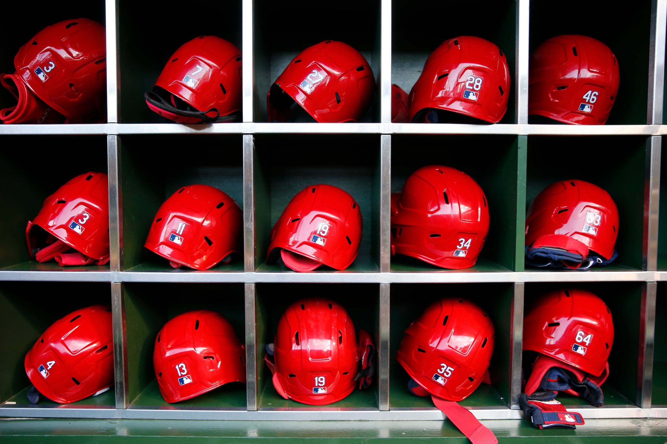 CHICAGO, IL - JUNE 12: Helmets belonging to St. Louis Cardinals players sit in the dugout prior to the game between the St. Louis Cardinals and the Chicago Cubs at Wrigley Field on Saturday, June 12, 2021 in Chicago, Illinois. (Photo by Nuccio DiNuzzo/MLB Photos via Getty Images)