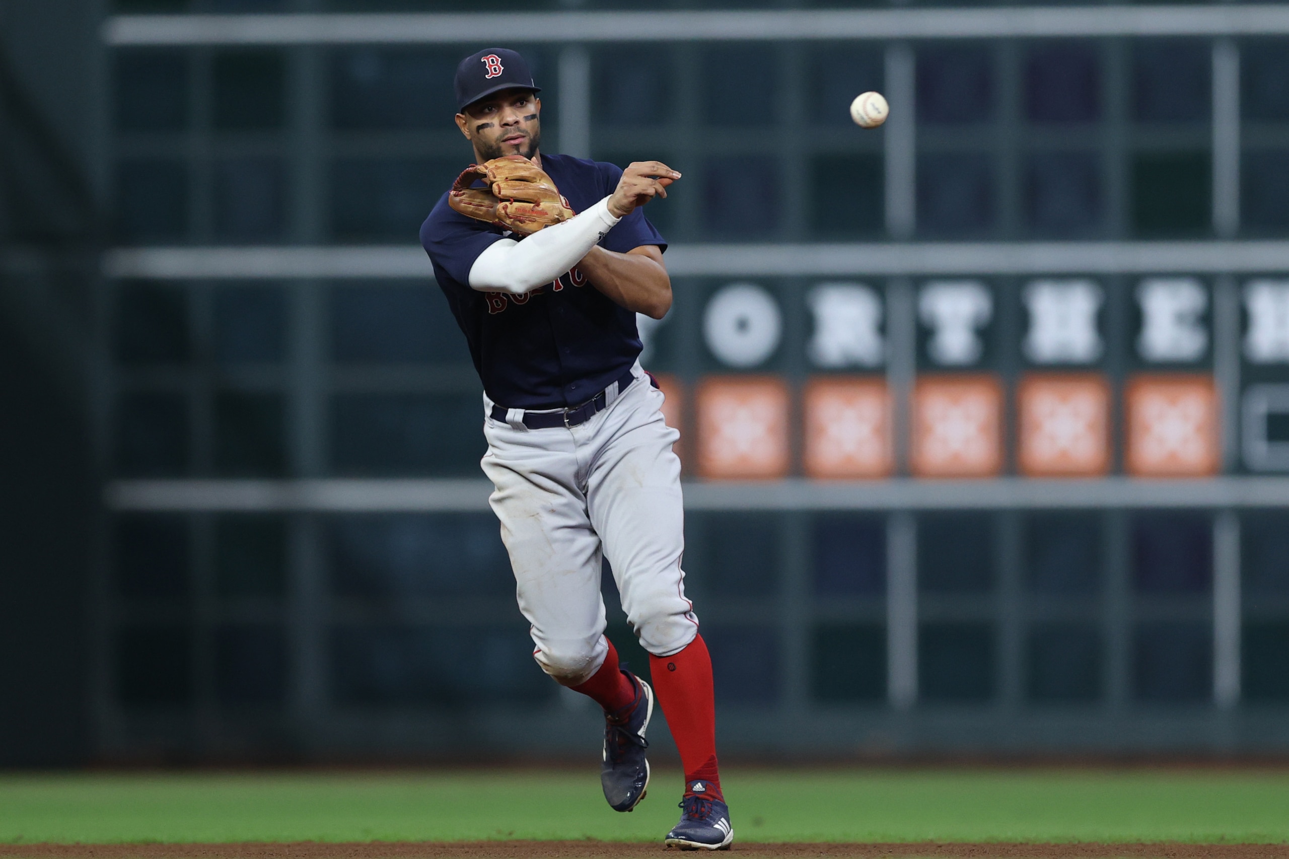 HOUSTON, TEXAS - OCTOBER 22: Xander Bogaerts #2 of the Boston Red Sox throws out a runner during the fifth inning against the Houston Astros in Game Six of the American League Championship Series at Minute Maid Park on October 22, 2021 in Houston, Texas. (Photo by Elsa/Getty Images)
