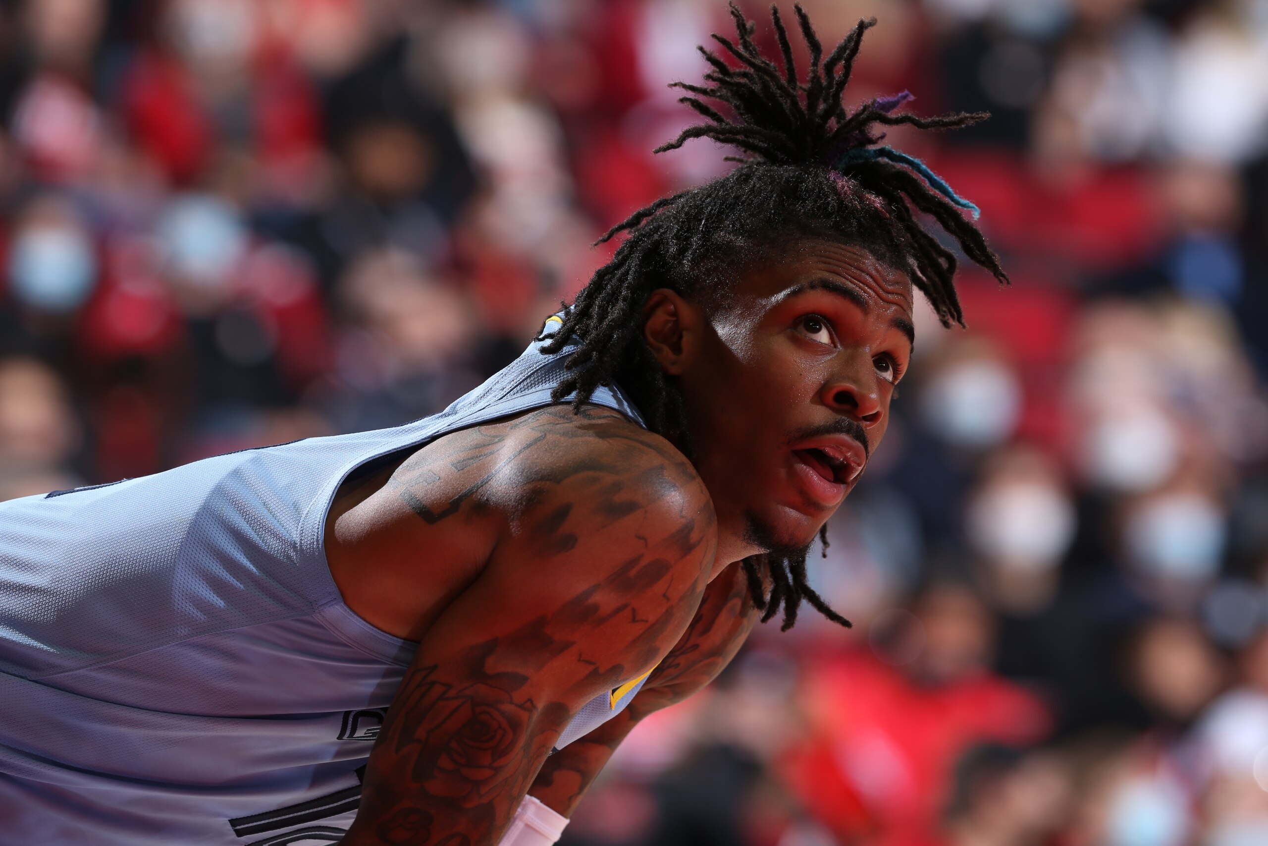 PORTLAND, OR - OCTOBER 27: Ja Morant #12 of the Memphis Grizzlies looks on during the game against the Portland Trail Blazers on October 27, 2021 at the Moda Center Arena in Portland, Oregon. NOTE TO USER: User expressly acknowledges and agrees that, by downloading and or using this photograph, user is consenting to the terms and conditions of the Getty Images License Agreement. Mandatory Copyright Notice: Copyright 2021 NBAE (Photo by Sam Forencich/NBAE via Getty Images)