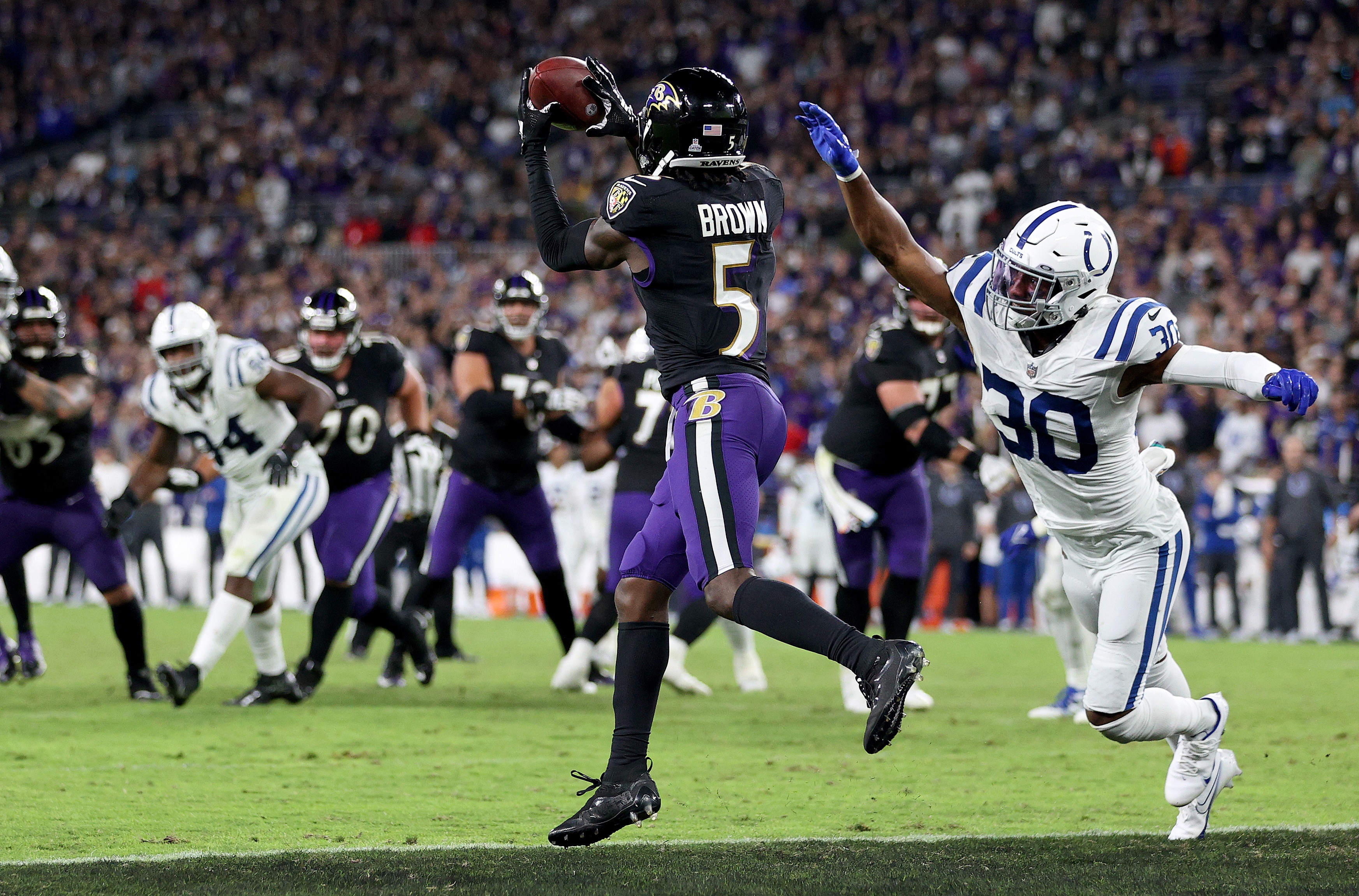 BALTIMORE, MARYLAND - OCTOBER 11: Marquise Brown #5 of the Baltimore Ravens catches the game winning touchdown during overtime  in a game against the Indianapolis Colts at M&T Bank Stadium on October 11, 2021 in Baltimore, Maryland. (Photo by Patrick Smith/Getty Images)