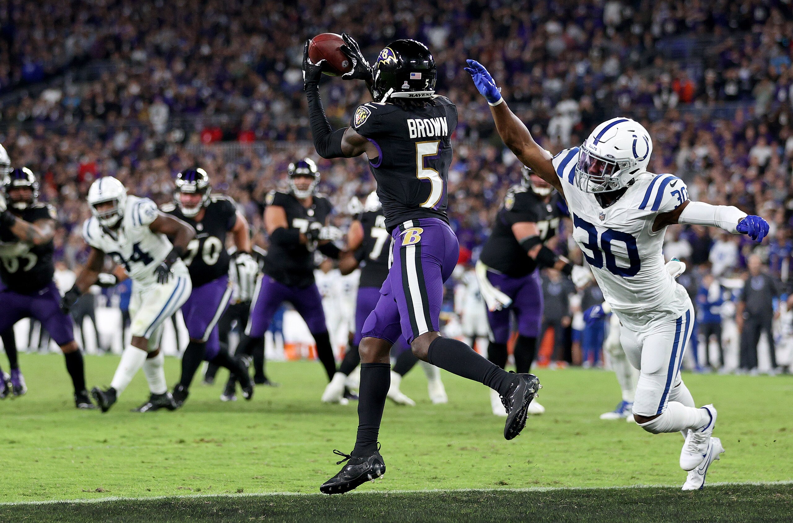 BALTIMORE, MARYLAND - OCTOBER 11: Marquise Brown #5 of the Baltimore Ravens catches the game winning touchdown during overtime  in a game against the Indianapolis Colts at M&T Bank Stadium on October 11, 2021 in Baltimore, Maryland. (Photo by Patrick Smith/Getty Images)