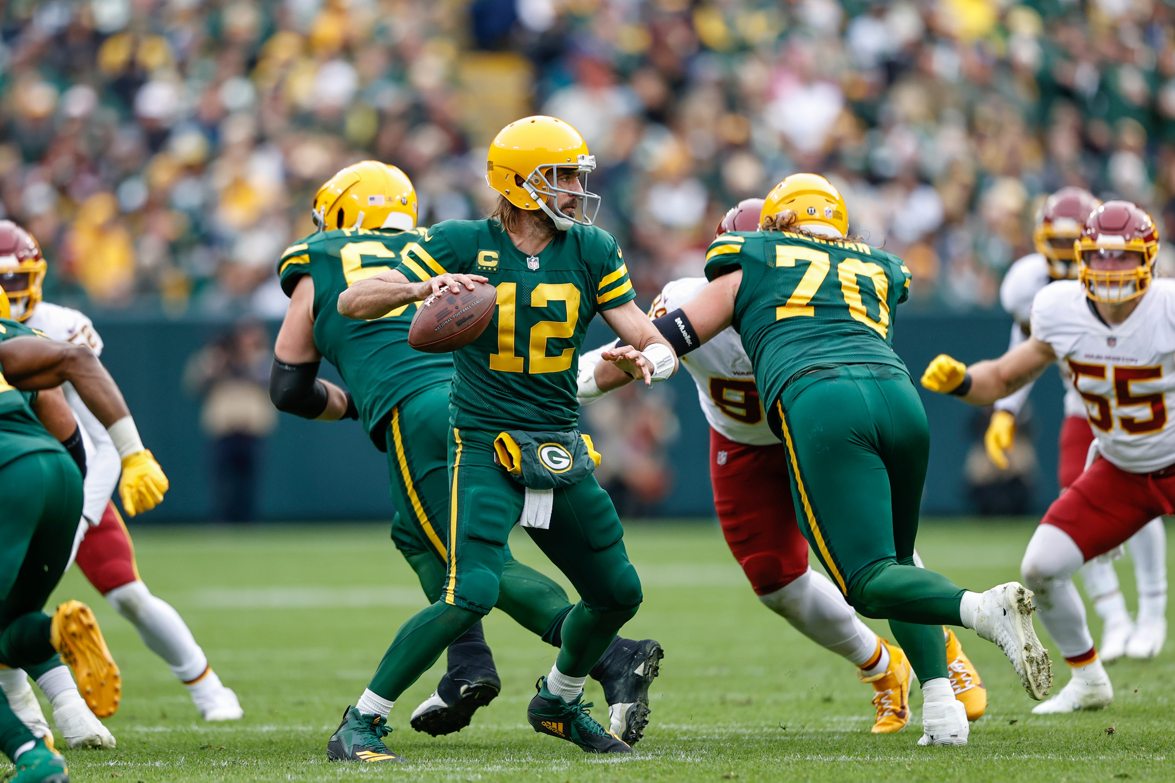 Green Bay Packers quarterback Aaron Rodgers (12) looks to pass the ball against the Washington Football Team during the second half of an NFL football game, Sunday, Oct. 24, 2021, in Green Bay, Wis. (AP Photo/Kamil Krzaczynski)