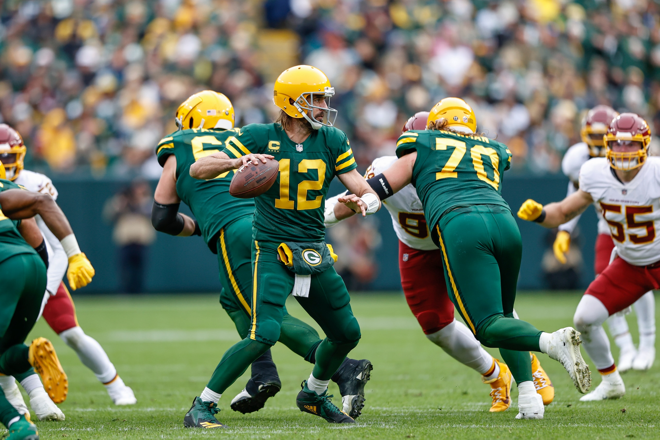 Green Bay Packers quarterback Aaron Rodgers (12) looks to pass the ball against the Washington Football Team during the second half of an NFL football game, Sunday, Oct. 24, 2021, in Green Bay, Wis. (AP Photo/Kamil Krzaczynski)