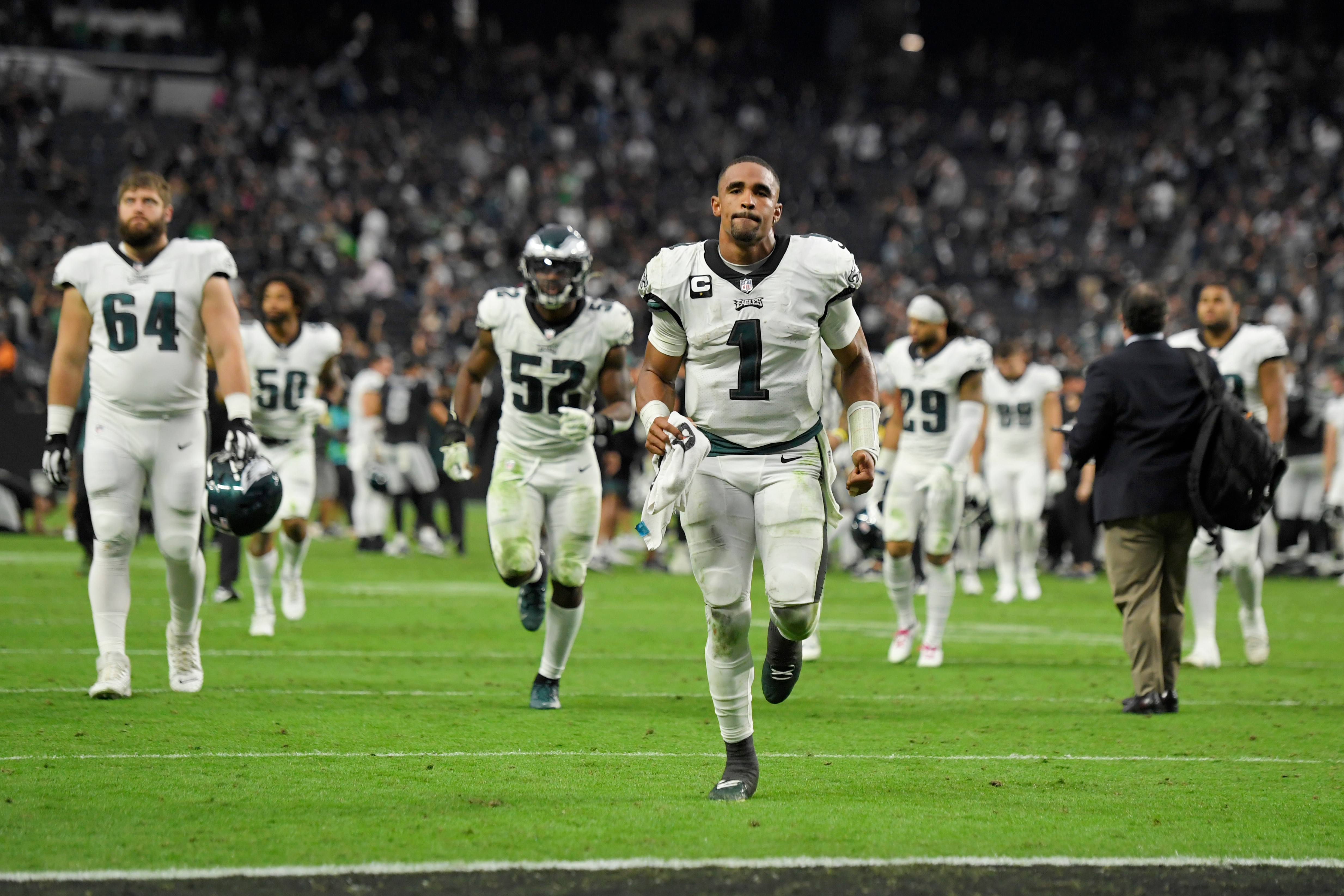 Philadelphia Eagles quarterback Jalen Hurts (1) runs off the field after a loss to the Las Vegas Raiders in an NFL football game, Sunday, Oct. 24, 2021, in Las Vegas. (AP Photo/David Becker)