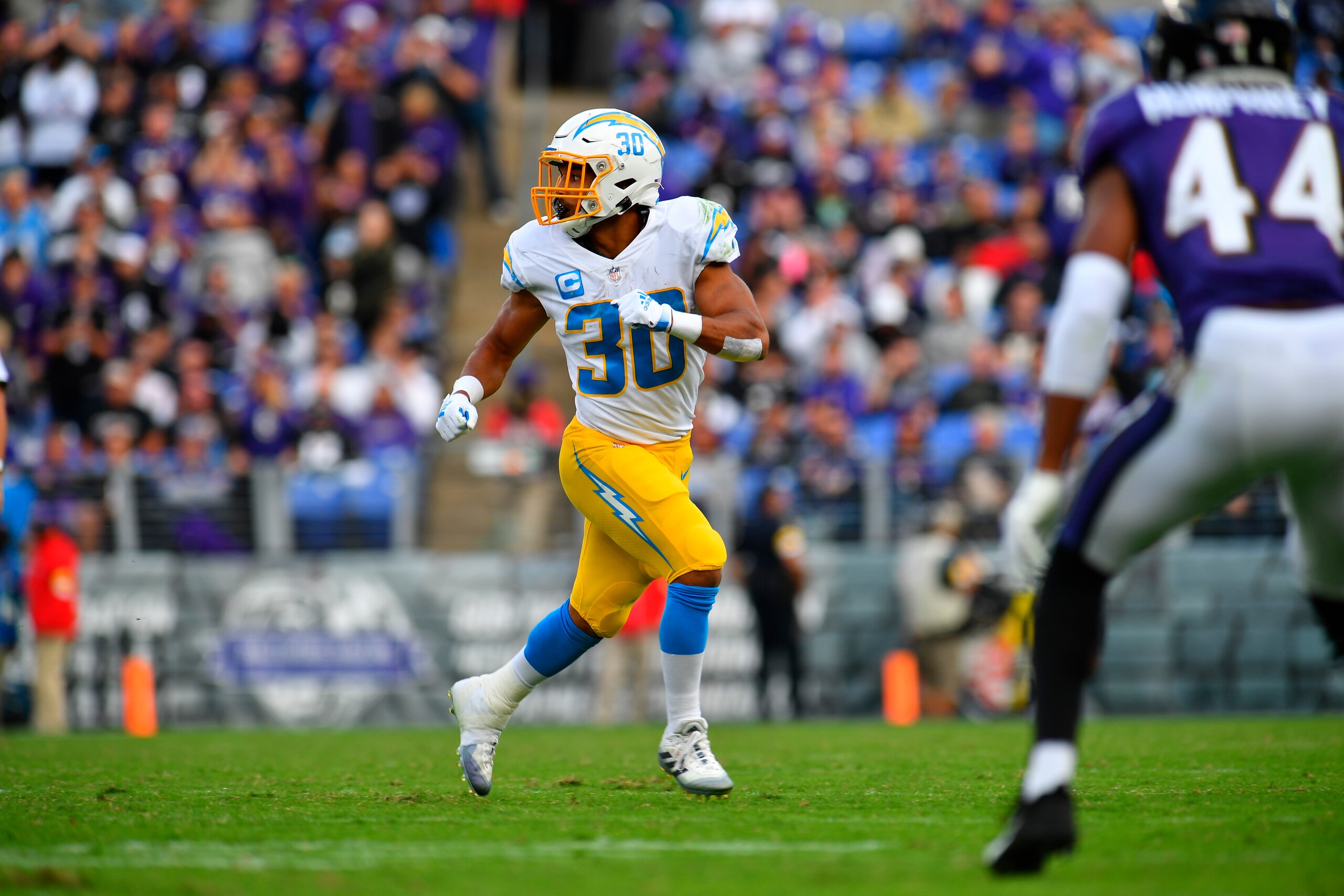 Los Angeles Chargers running back Austin Ekeler (30) looks for a pass during an NFL football game between the Baltimore Ravens and the Los Angeles Chargers on Sunday, Oct. 17, 2021, in Baltimore. (AP Photo/Larry French)