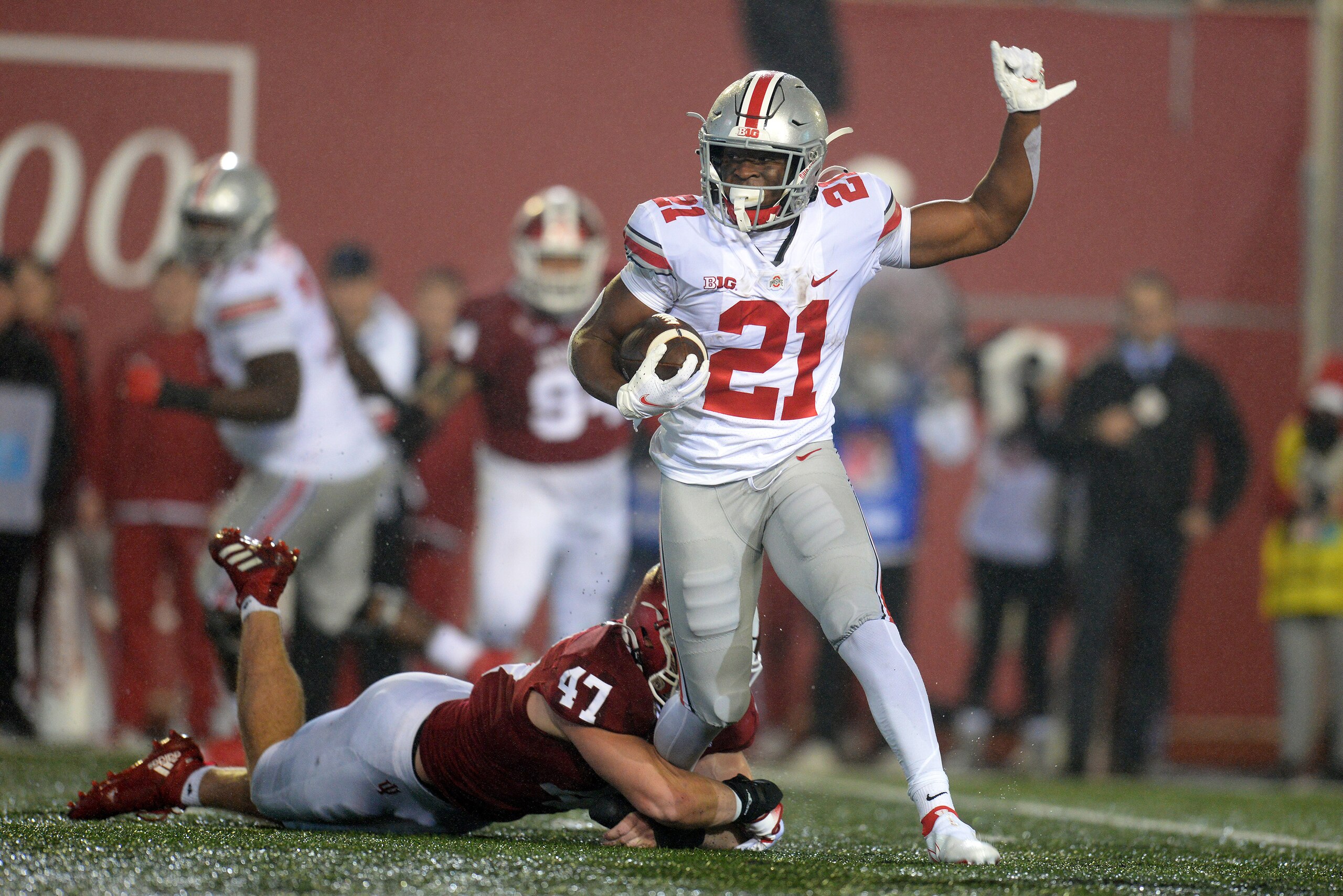 BLOOMINGTON, IN - OCTOBER 23: Indiana Hoosiers linebacker Micah McFadden (47) wraps up the ankle of Ohio State Buckeyes running back Evan Pryor (21) during the Big Ten conference college football game between the Ohio State Buckeyes and the Indiana Hoosiers on October 23, 2021, at Memorial Stadium in Bloomington, Indiana. (Photo by Michael Allio/Icon Sportswire via Getty Images) BLOOMINGTON, IN - OCTOBER 23: Indiana Hoosiers linebacker Micah McFadden (47) wraps up the ankle of Ohio State Buckeyes running back Evan Pryor (21) during the Big Ten conference college football game between the Ohio State Buckeyes and the Indiana Hoosiers on October 23, 2021, at Memorial Stadium in Bloomington, Indiana. (Photo by Michael Allio/Icon Sportswire via Getty Images)