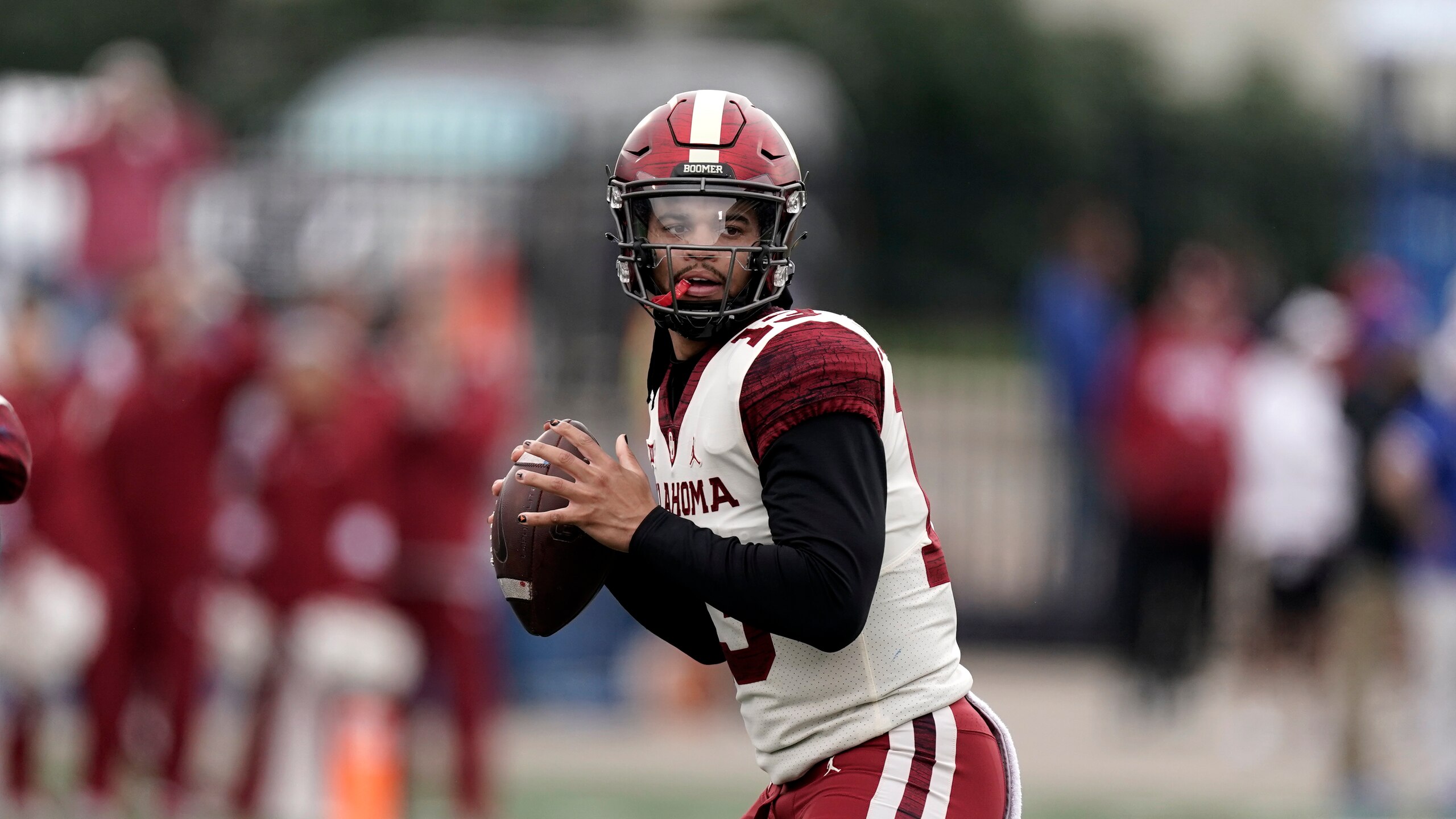 Oklahoma quarterback Caleb Williams looks to throw during the first half of an NCAA college football game against Kansas Saturday, Oct. 23, 2021, in Lawrence, Kan. (AP Photo/Charlie Riedel) Oklahoma quarterback Caleb Williams looks to throw during the first half of an NCAA college football game against Kansas Saturday, Oct. 23, 2021, in Lawrence, Kan. (AP Photo/Charlie Riedel)
