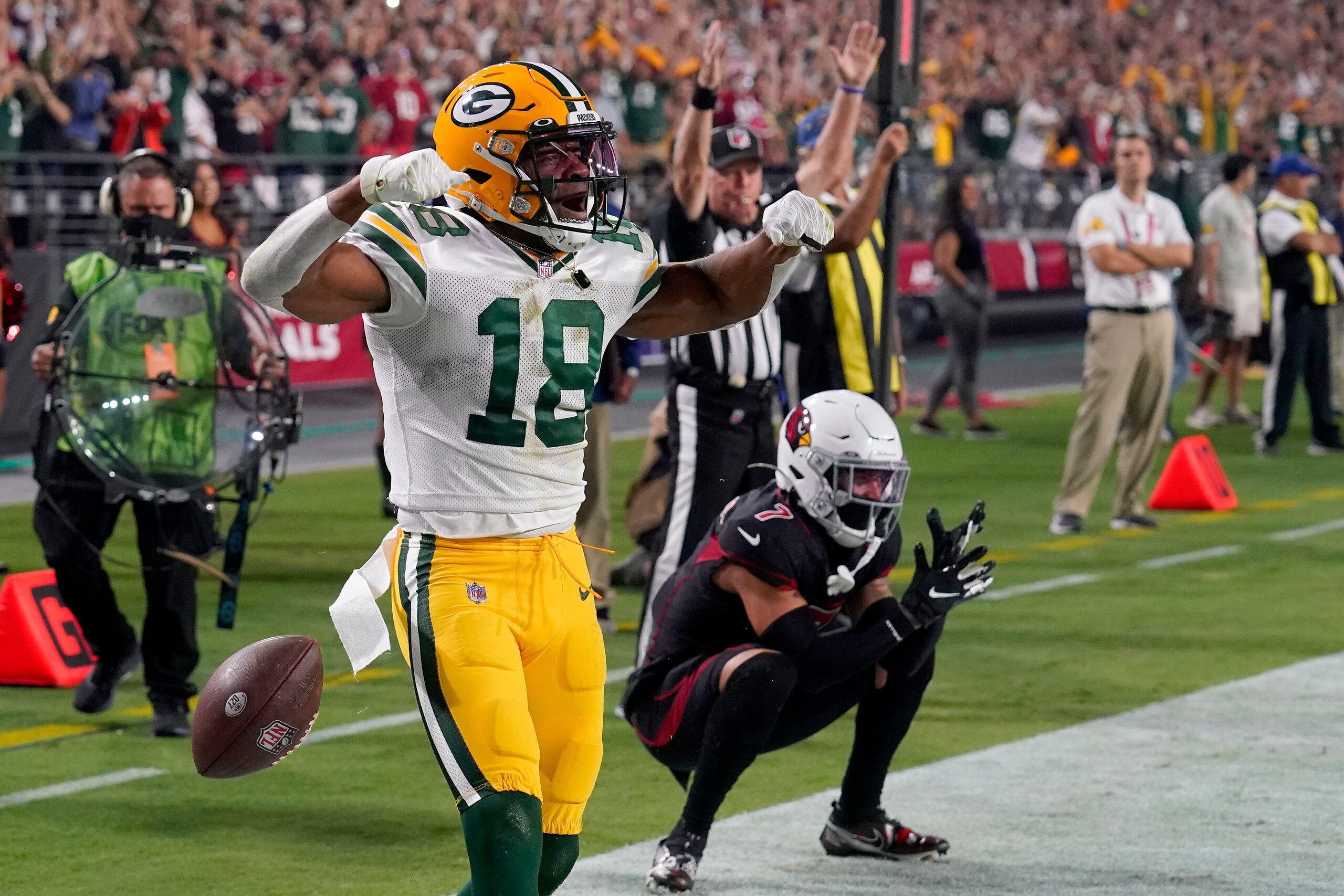 Green Bay Packers wide receiver Randall Cobb (18) celebrates his touchdown as Arizona Cardinals cornerback Byron Murphy looks on during the second half of an NFL football game, Thursday, Oct. 28, 2021, in Glendale, Ariz. (AP Photo/Rick Scuteri)