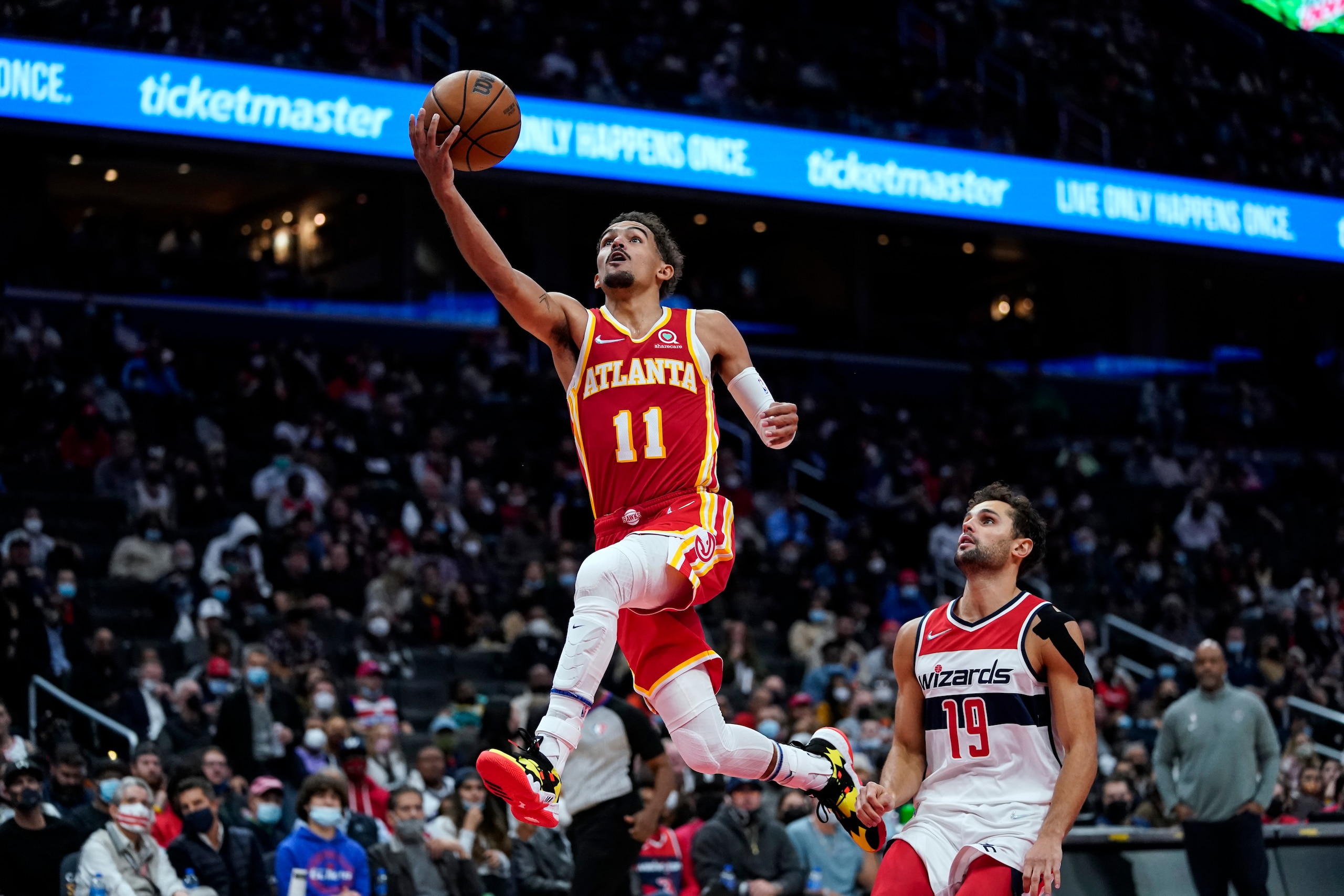 Atlanta Hawks guard Trae Young (11) drives past Washington Wizards guard Raul Neto (19) during the second half of an NBA basketball game Thursday, Oct. 28, 2021, in Washington. The Wizards won 122-111. (AP Photo/Alex Brandon) Atlanta Hawks guard Trae Young (11) drives past Washington Wizards guard Raul Neto (19) during the second half of an NBA basketball game Thursday, Oct. 28, 2021, in Washington. The Wizards won 122-111. (AP Photo/Alex Brandon)