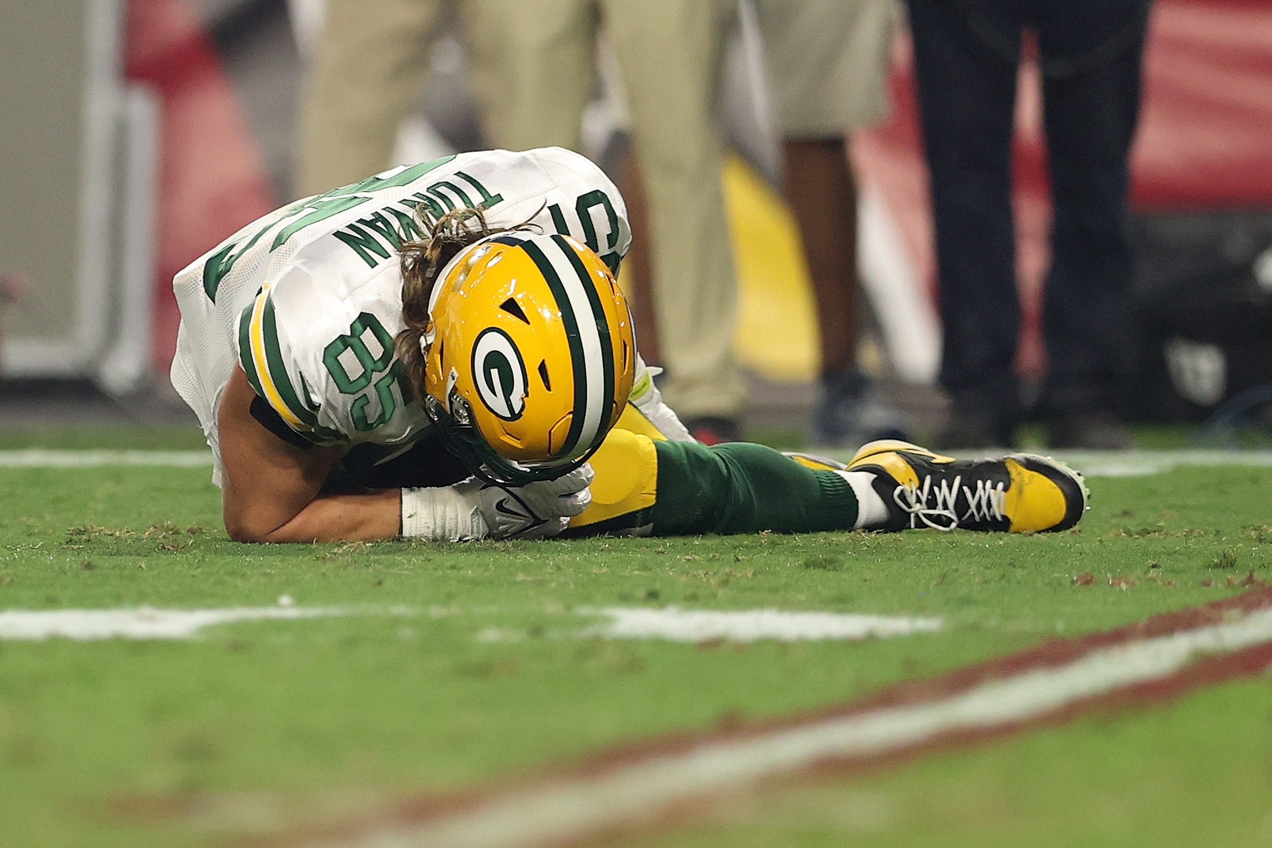GLENDALE, ARIZONA - OCTOBER 28: Robert Tonyan #85 of the Green Bay Packers is injured on a play during the second half of a game against the Arizona Cardinals at State Farm Stadium on October 28, 2021 in Glendale, Arizona. (Photo by Christian Petersen/Getty Images)