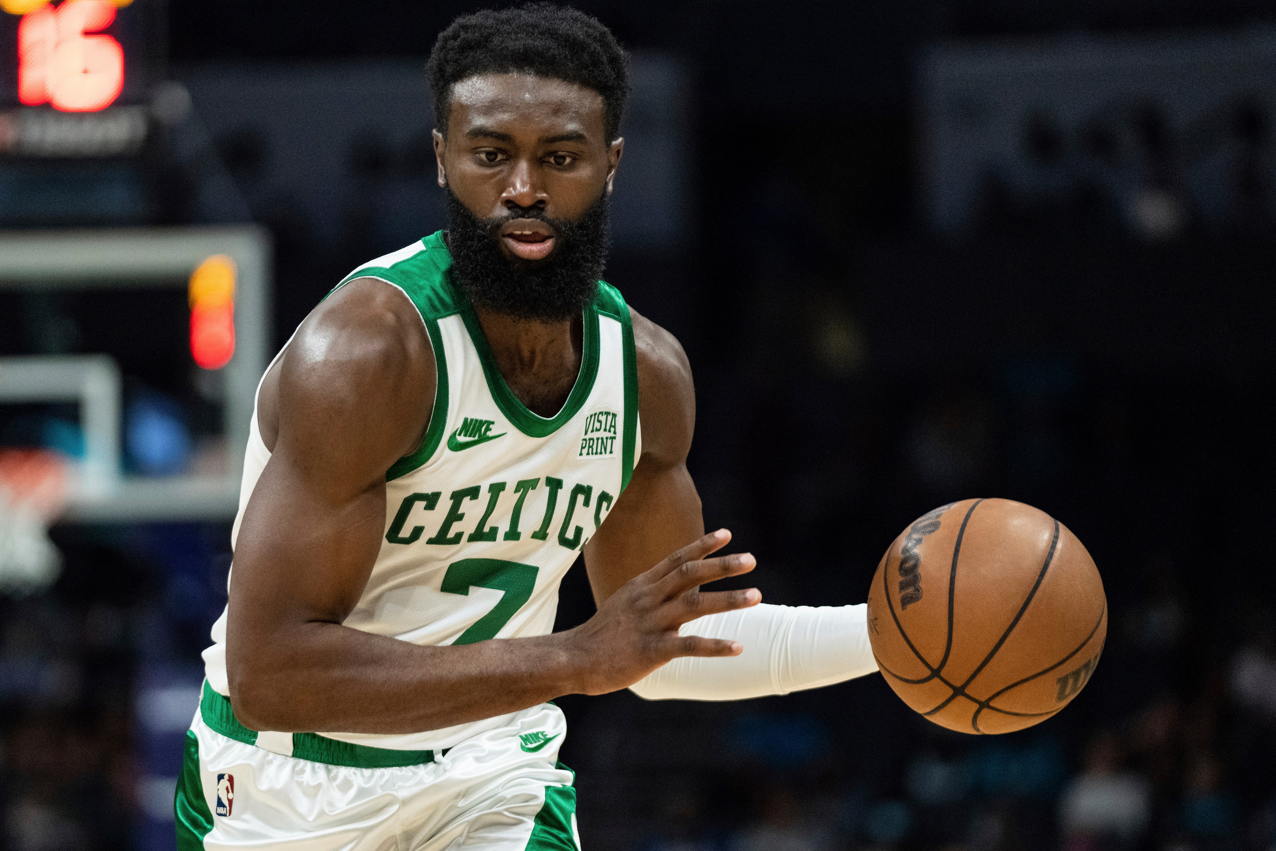 Boston Celtics guard Jaylen Brown (7) brings the ball up court against the Charlotte Hornets during an NBA basketball game in Charlotte, N.C., Monday, Oct. 25, 2021. (AP Photo/Jacob Kupferman)