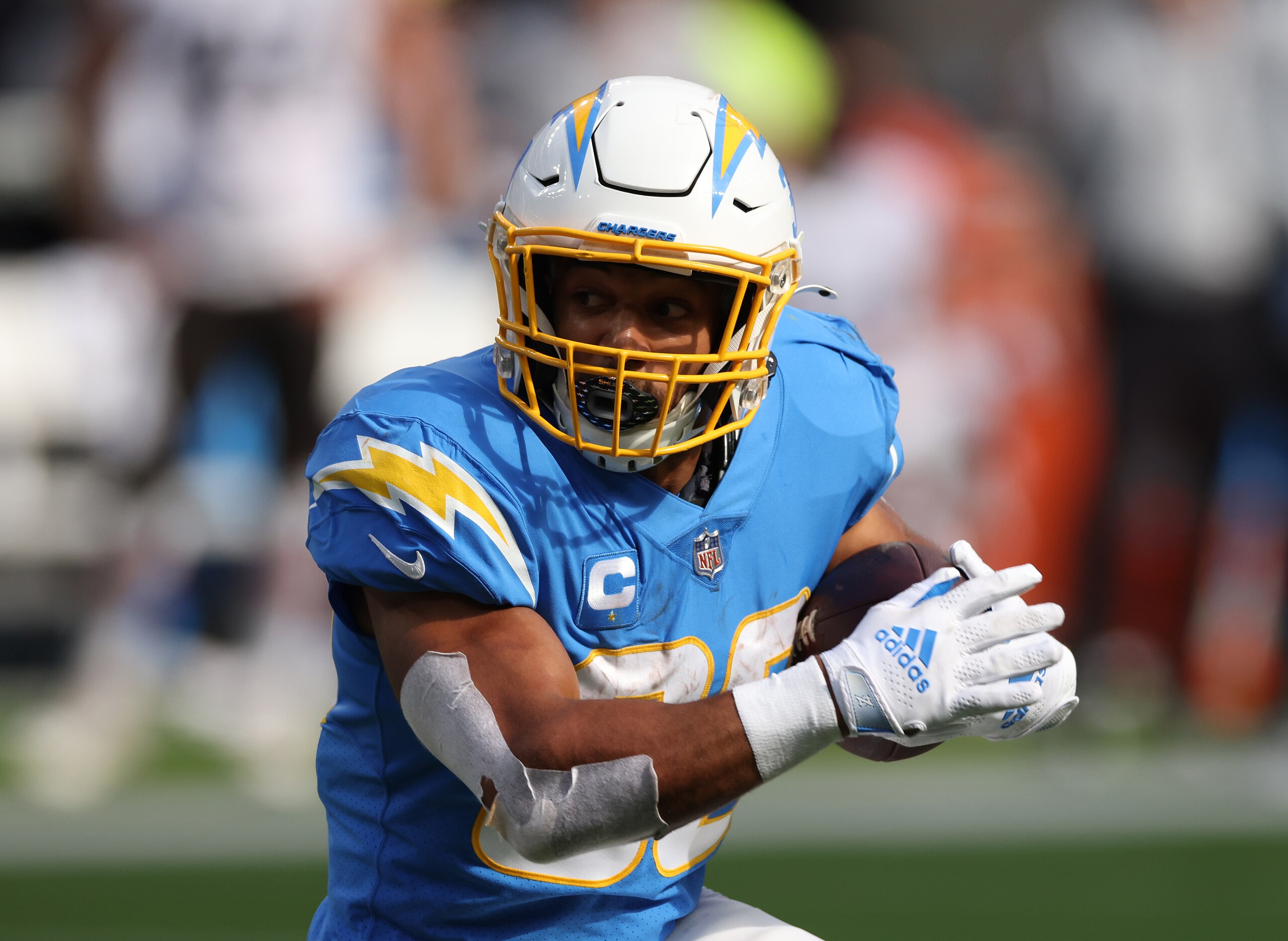 INGLEWOOD, CALIFORNIA - OCTOBER 10: Austin Ekeler #30 of the Los Angeles Chargers carries the ball during a 47-42 win over the Cleveland Browns at SoFi Stadium on October 10, 2021 in Inglewood, California. (Photo by Harry How/Getty Images)