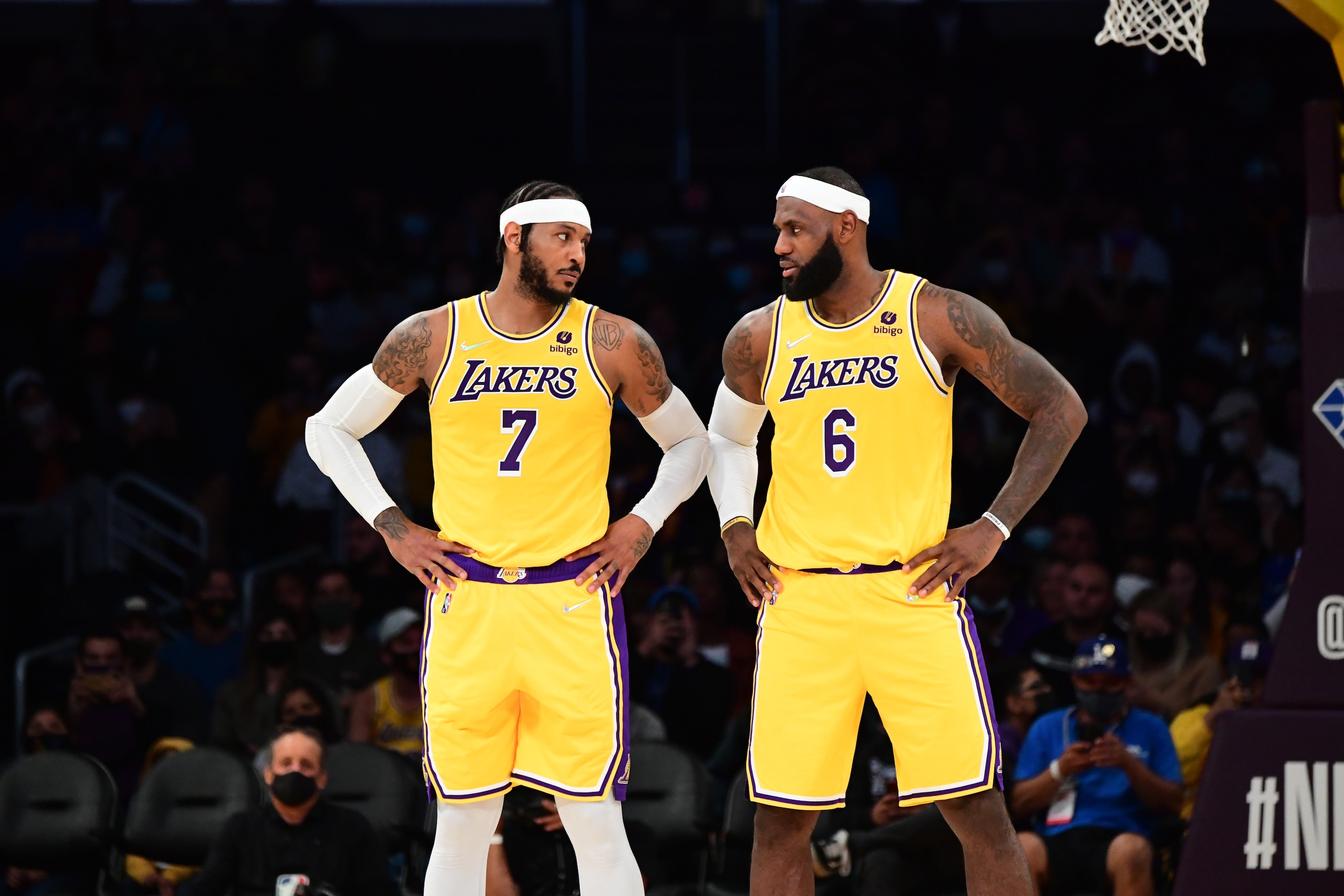 LOS ANGELES, CA - OCTOBER 12: Carmelo Anthony #7 and LeBron James #6 of the Los Angeles Lakers look at each other during a preseason game against the Golden State Warriors on October 12, 2021 at STAPLES Center in Los Angeles, California. NOTE TO USER: User expressly acknowledges and agrees that, by downloading and/or using this Photograph, user is consenting to the terms and conditions of the Getty Images License Agreement. Mandatory Copyright Notice: Copyright 2021 NBAE (Photo by Adam Pantozzi/NBAE via Getty Images)