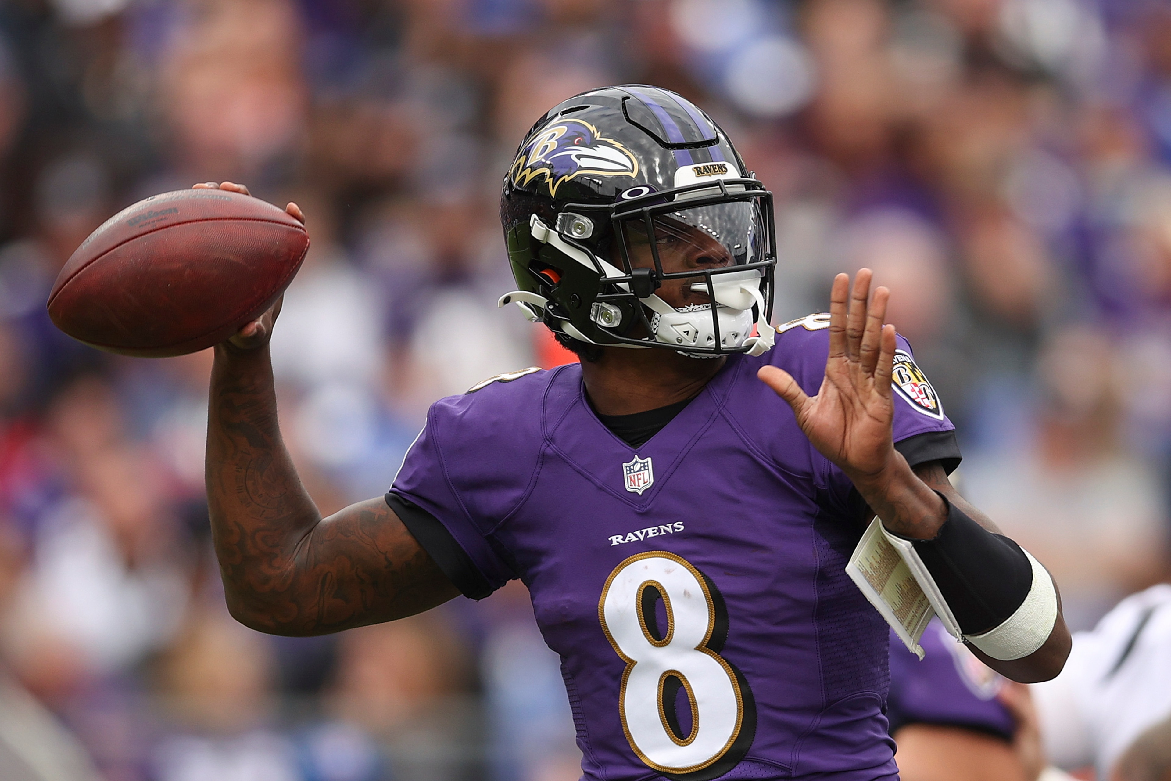 BALTIMORE, MARYLAND - OCTOBER 24: Lamar Jackson #8 of the Baltimore Ravens throws the ball during the first half in the game against the Cincinnati Bengals at M&T Bank Stadium on October 24, 2021 in Baltimore, Maryland. (Photo by Patrick Smith/Getty Images)