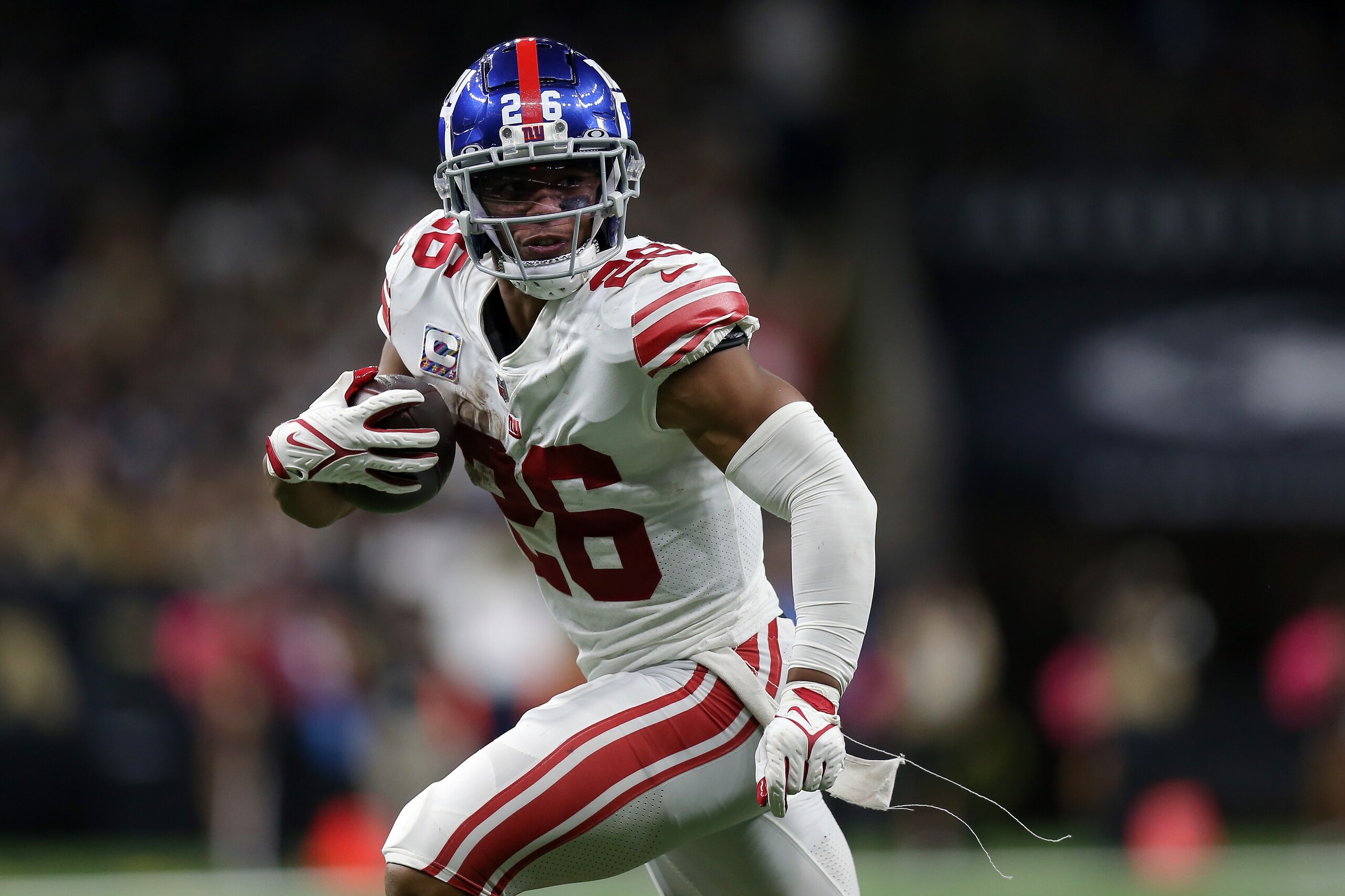 NEW ORLEANS, LOUISIANA - OCTOBER 03: Saquon Barkley #26 of the New York Giants runs the ball for a touchdown in the game against the New Orleans Saints in overtime at Caesars Superdome on October 03, 2021 in New Orleans, Louisiana. (Photo by Jonathan Bachman/Getty Images)