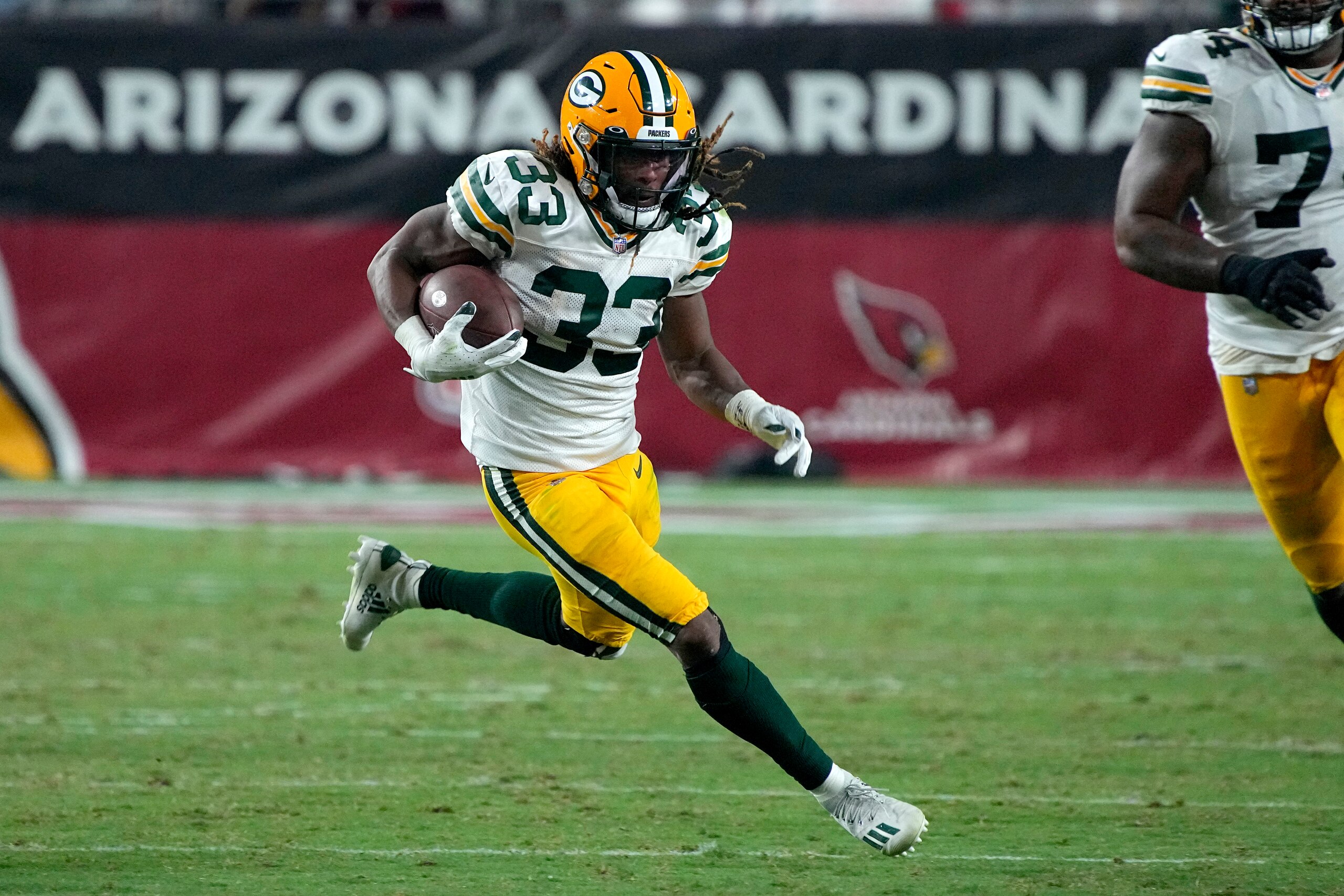 Green Bay Packers running back Aaron Jones (33) against the Arizona Cardinals during the first half of an NFL football game, Thursday, Oct. 28, 2021, in Glendale, Ariz. (AP Photo/Rick Scuteri)