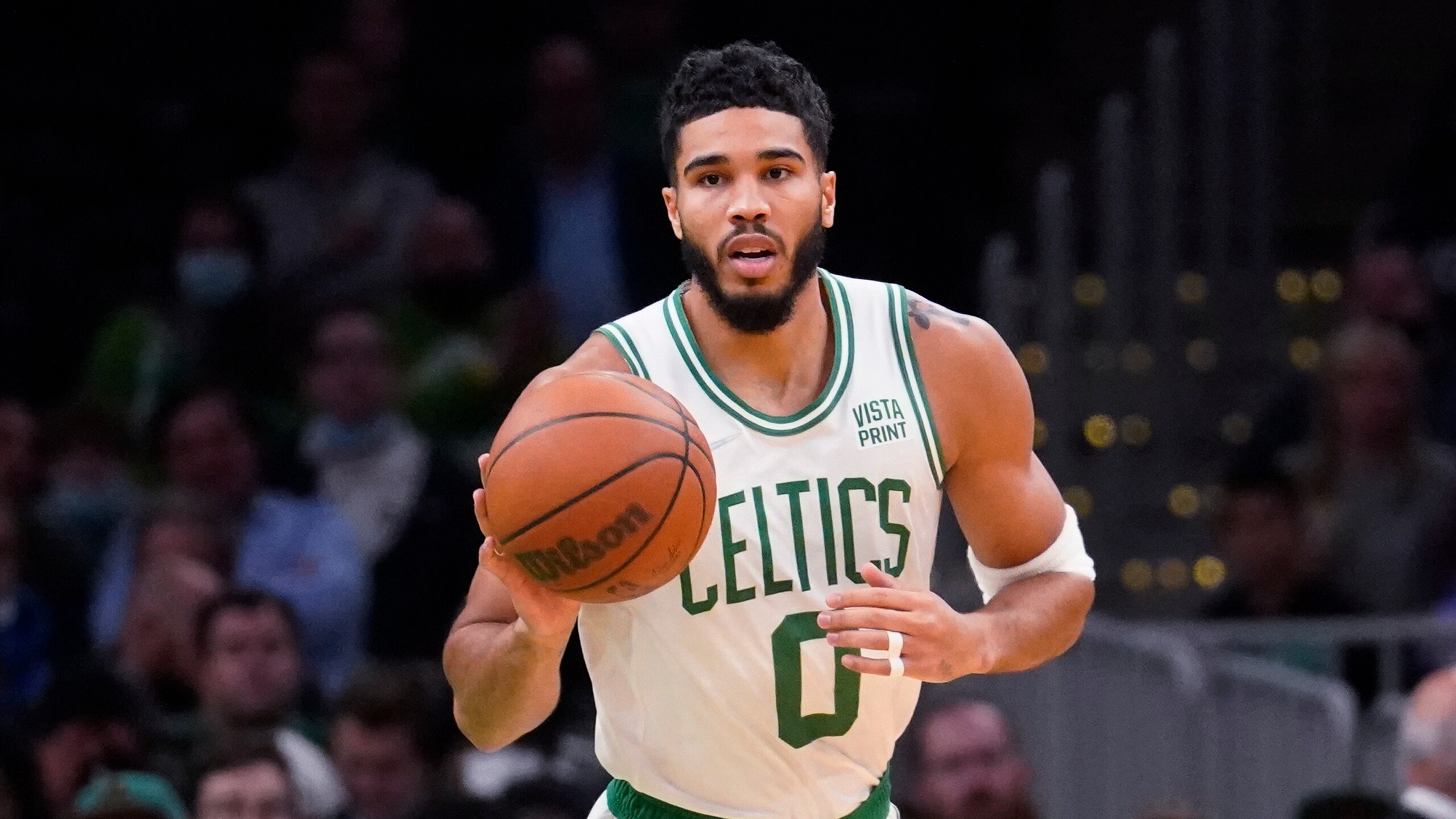 Boston Celtics forward Jayson Tatum (0) dribbles the ball down court during the first half of an NBA basketball game against the Washington Wizards, Wednesday, Oct. 27, 2021, in Boston. (AP Photo/Charles Krupa)