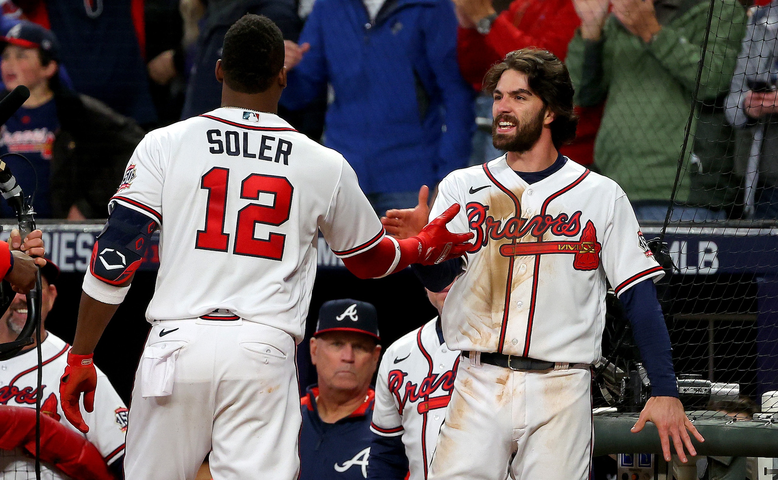 ATLANTA, GEORGIA - OCTOBER 30: Jorge Soler #12 of the Atlanta Braves is congratulated by Dansby Swanson #7 after they hit back-to-back solo home runs against the Houston Astros during the seventh inning in Game Four of the World Series at Truist Park on October 30, 2021 in Atlanta, Georgia. (Photo by Kevin C. Cox/Getty Images) ATLANTA, GEORGIA - OCTOBER 30: Jorge Soler #12 of the Atlanta Braves is congratulated by Dansby Swanson #7 after they hit back-to-back solo home runs against the Houston Astros during the seventh inning in Game Four of the World Series at Truist Park on October 30, 2021 in Atlanta, Georgia. (Photo by Kevin C. Cox/Getty Images)