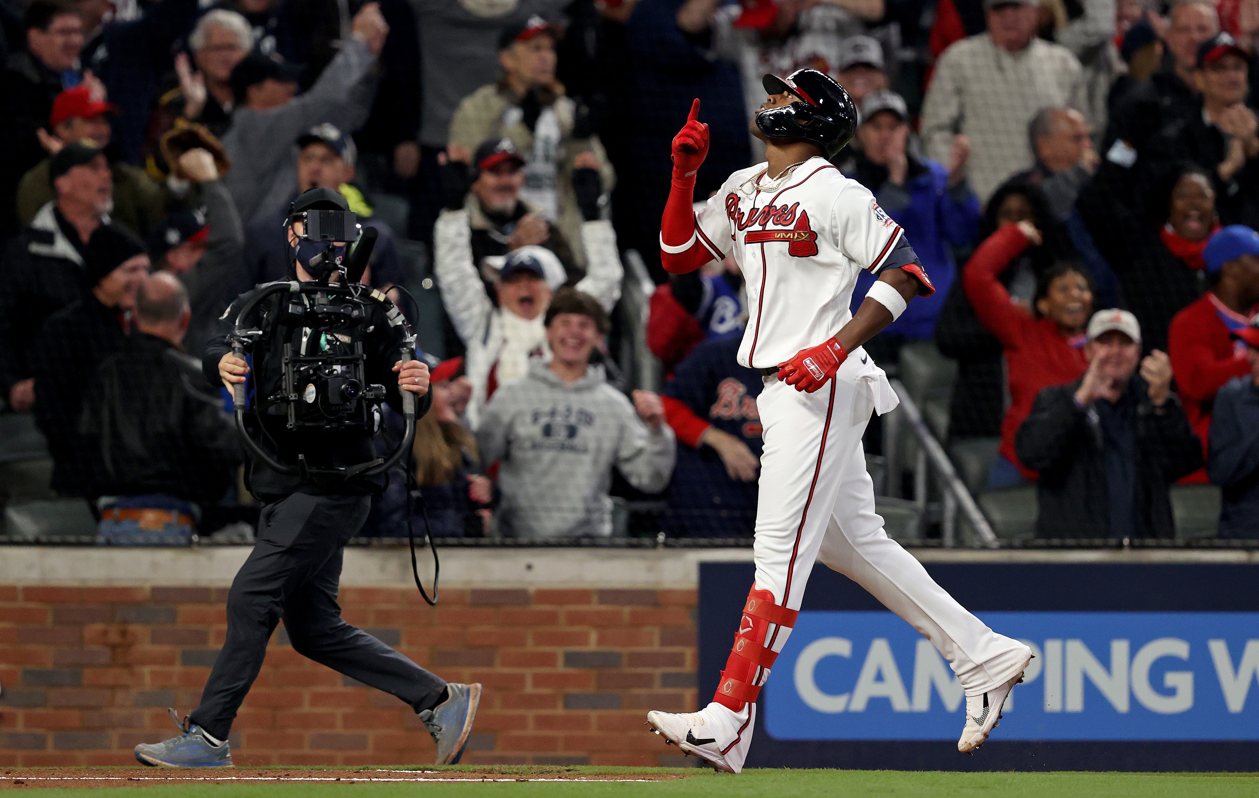 ATLANTA, GEORGIA - OCTOBER 30:  Jorge Soler #12 of the Atlanta Braves celebrates after hitting a solo home run against the Houston Astros during the seventh inning in Game Four of the World Series at Truist Park on October 30, 2021 in Atlanta, Georgia. (Photo by Elsa/Getty Images)
