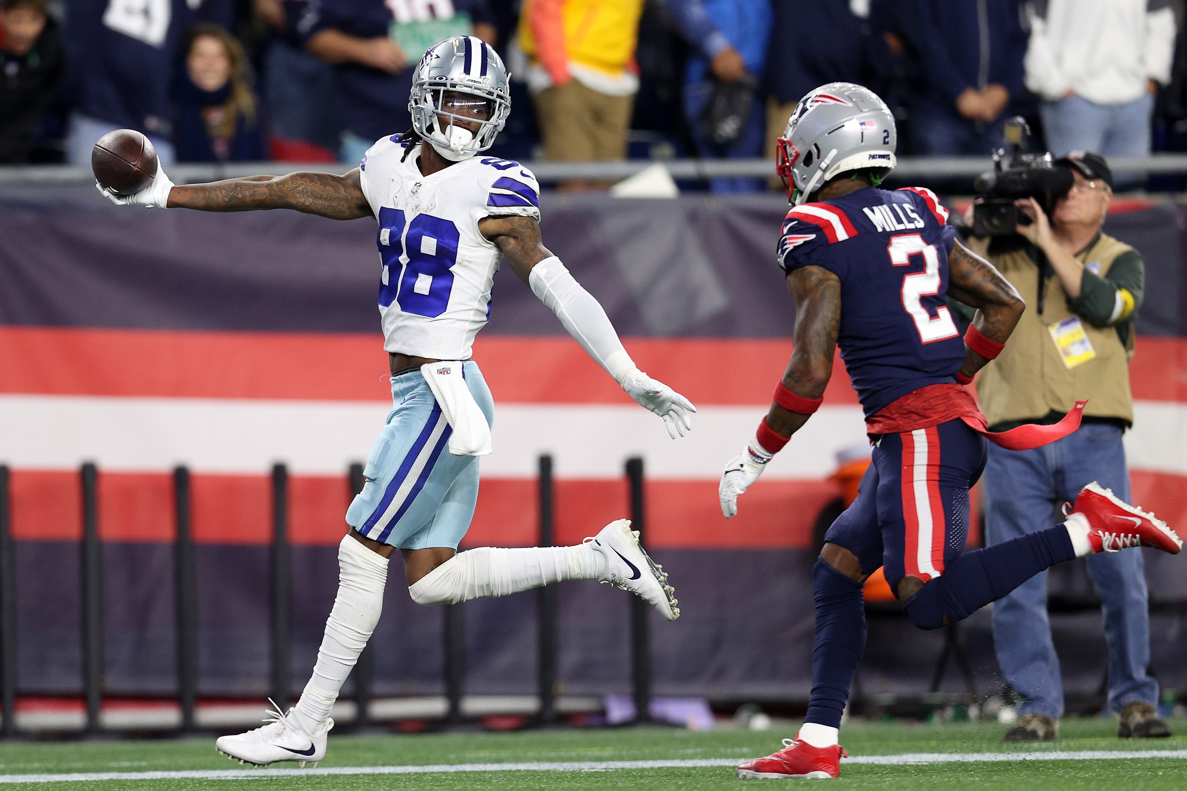 FOXBOROUGH, MASSACHUSETTS - OCTOBER 17: CeeDee Lamb #88 of the Dallas Cowboys celebrates after catching the game winning touchdown against Jalen Mills #2 of the New England Patriots in overtime at Gillette Stadium on October 17, 2021 in Foxborough, Massachusetts. The Cowboys defeated the Patriots 35-29 in overtime. (Photo by Maddie Meyer/Getty Images)
