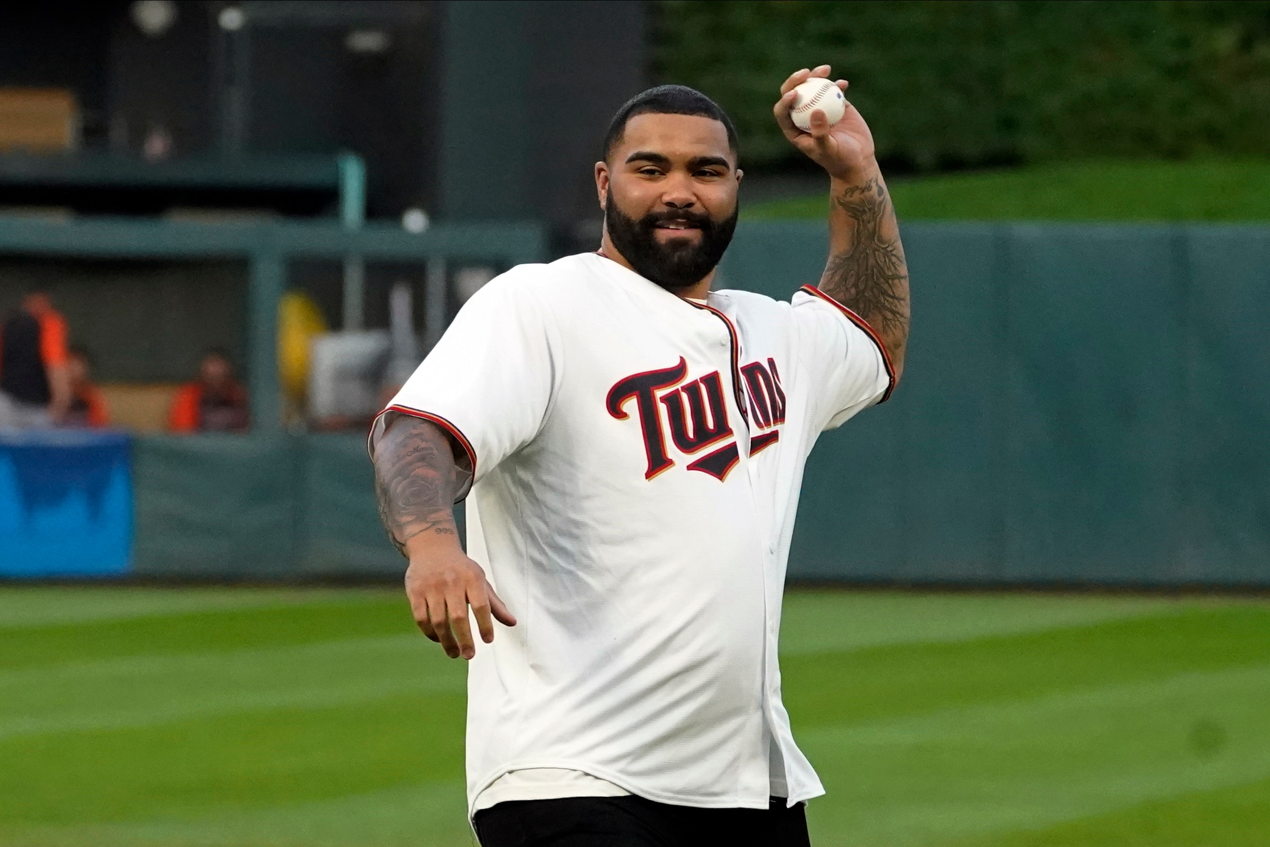 Olympic gold winner, wrestler Gable Steveson, winds up to throw a ceremonial first pitch before the Minnesota Twins and Detroit Tigers baseball game, Tuesday, Sept. 28, 2021, in Minneapolis. (AP Photo/Jim Mone)