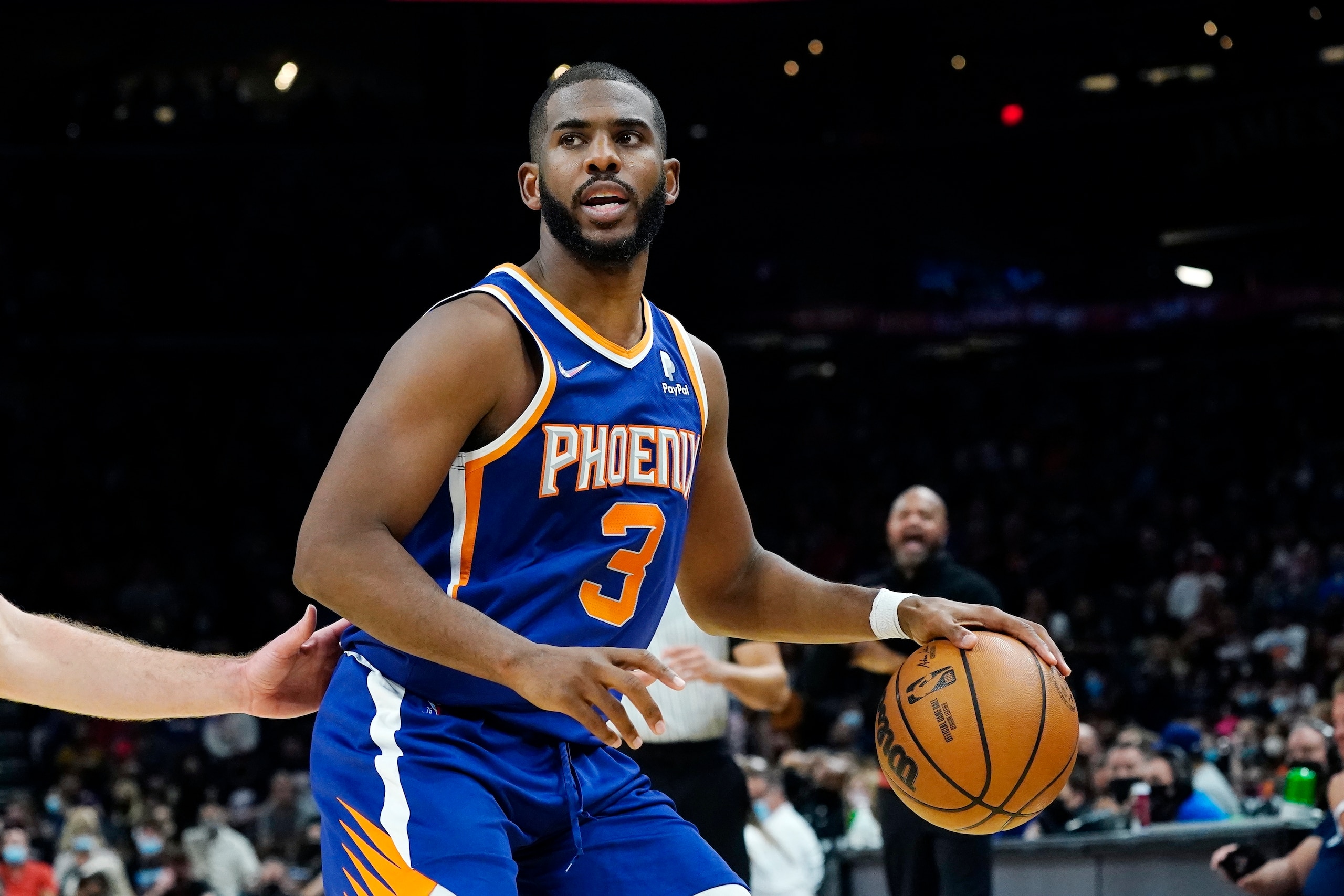 Phoenix Suns guard Chris Paul dribbles the ball against the Cleveland Cavaliers during the second half of an NBA basketball game Saturday, Oct. 30, 2021, in Phoenix. The Suns won 101-92. (AP Photo/Ross D. Franklin)