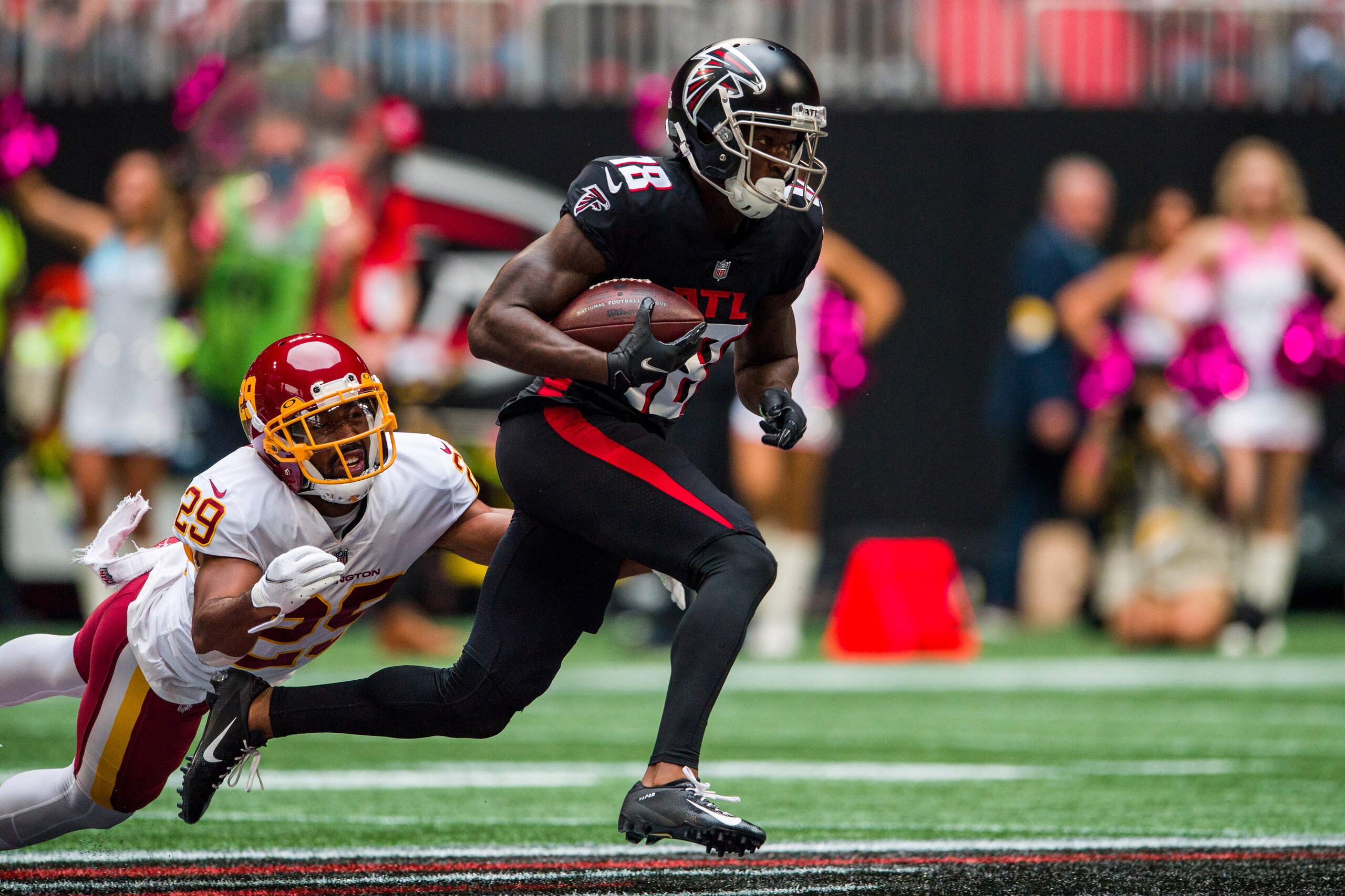 Atlanta Falcons wide receiver Calvin Ridley (18) runs the ball as Washington Football Team cornerback Kendall Fuller (29) defends during the first half of an NFL football game, Sunday, Oct. 3, 2021, in Atlanta. (AP Photo/Danny Karnik) Atlanta Falcons wide receiver Calvin Ridley (18) runs the ball as Washington Football Team cornerback Kendall Fuller (29) defends during the first half of an NFL football game, Sunday, Oct. 3, 2021, in Atlanta. (AP Photo/Danny Karnik)