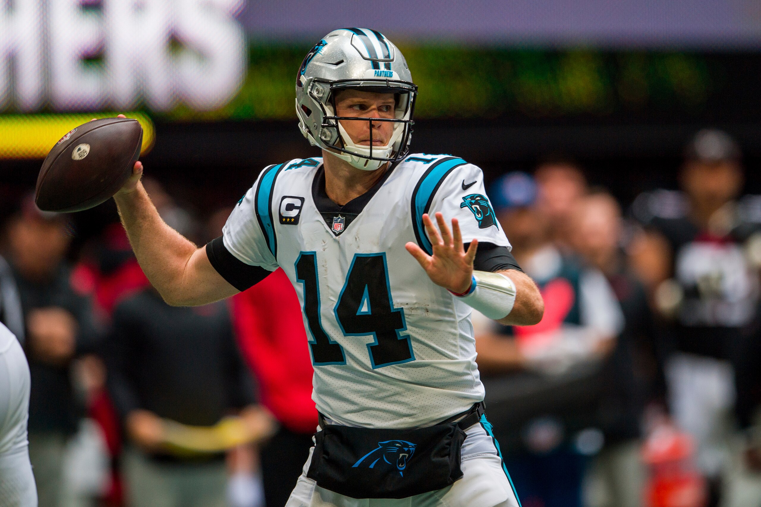 Carolina Panthers quarterback Sam Darnold (14) works during the first half of an NFL football game against the Atlanta Falcons, Sunday, Oct. 31, 2021, in Atlanta. (AP Photo/Danny Karnik)