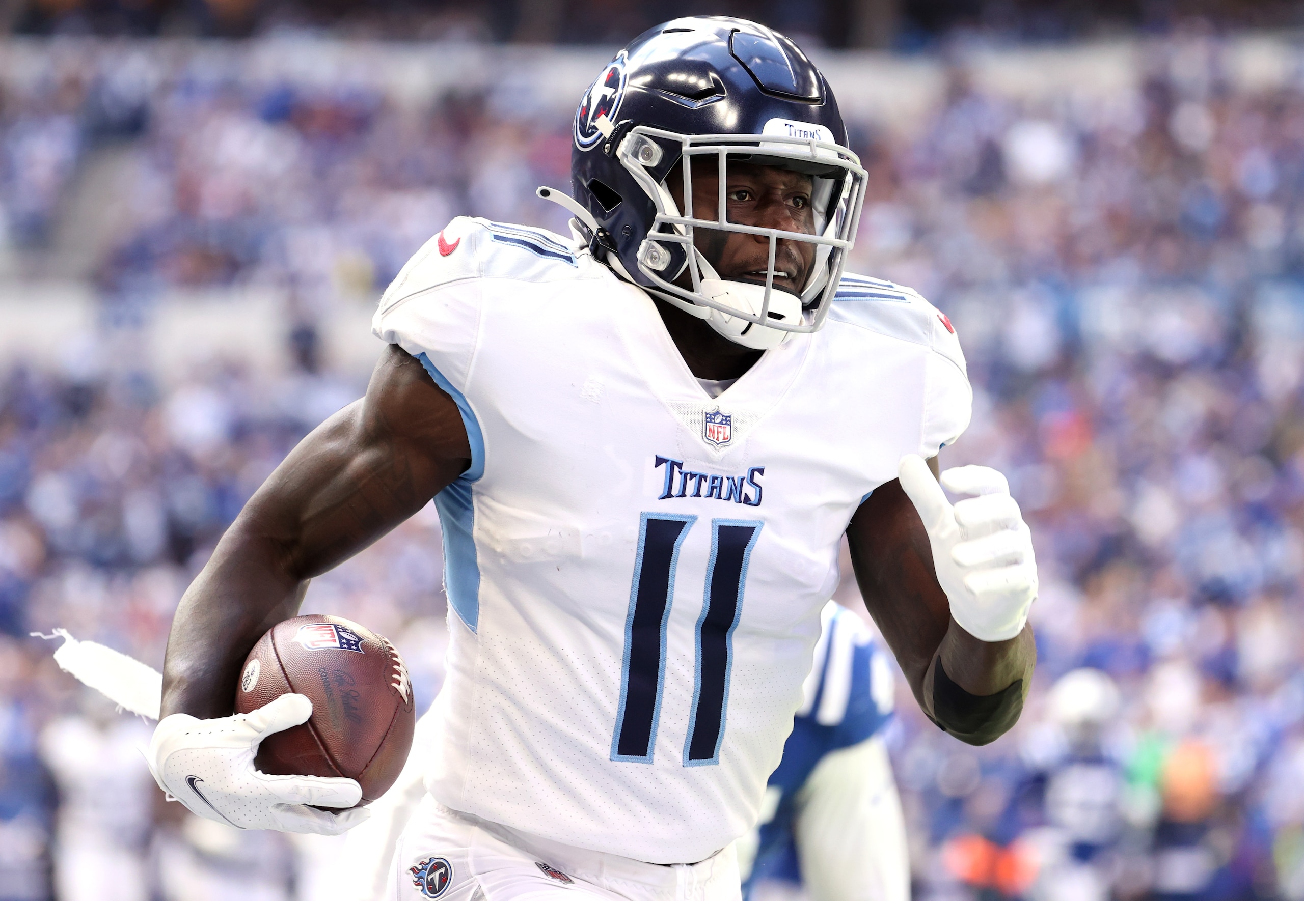 INDIANAPOLIS, INDIANA - OCTOBER 31: A.J. Brown #11 of the Tennessee Titans carries the ball for a touchdown in the first half of their game against the Indianapolis Colts at Lucas Oil Stadium on October 31, 2021 in Indianapolis, Indiana. (Photo by Andy Lyons/Getty Images)
