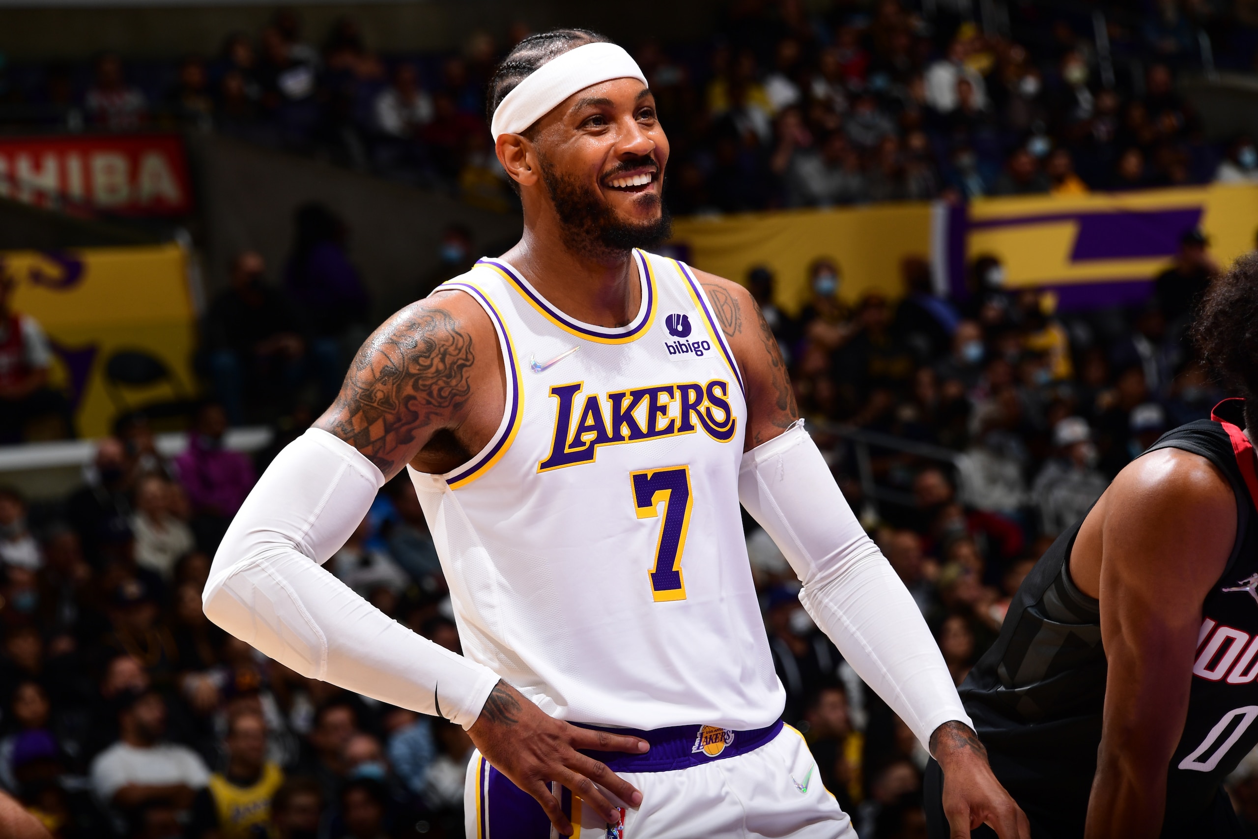 LOS ANGELES, CA - OCTOBER 31: Carmelo Anthony #7 of the Los Angeles Lakers smiles during the game against the Houston Rockets on October 31, 2021 at STAPLES Center in Los Angeles, California. NOTE TO USER: User expressly acknowledges and agrees that, by downloading and/or using this Photograph, user is consenting to the terms and conditions of the Getty Images License Agreement. Mandatory Copyright Notice: Copyright 2021 NBAE (Photo by Adam Pantozzi/NBAE via Getty Images)