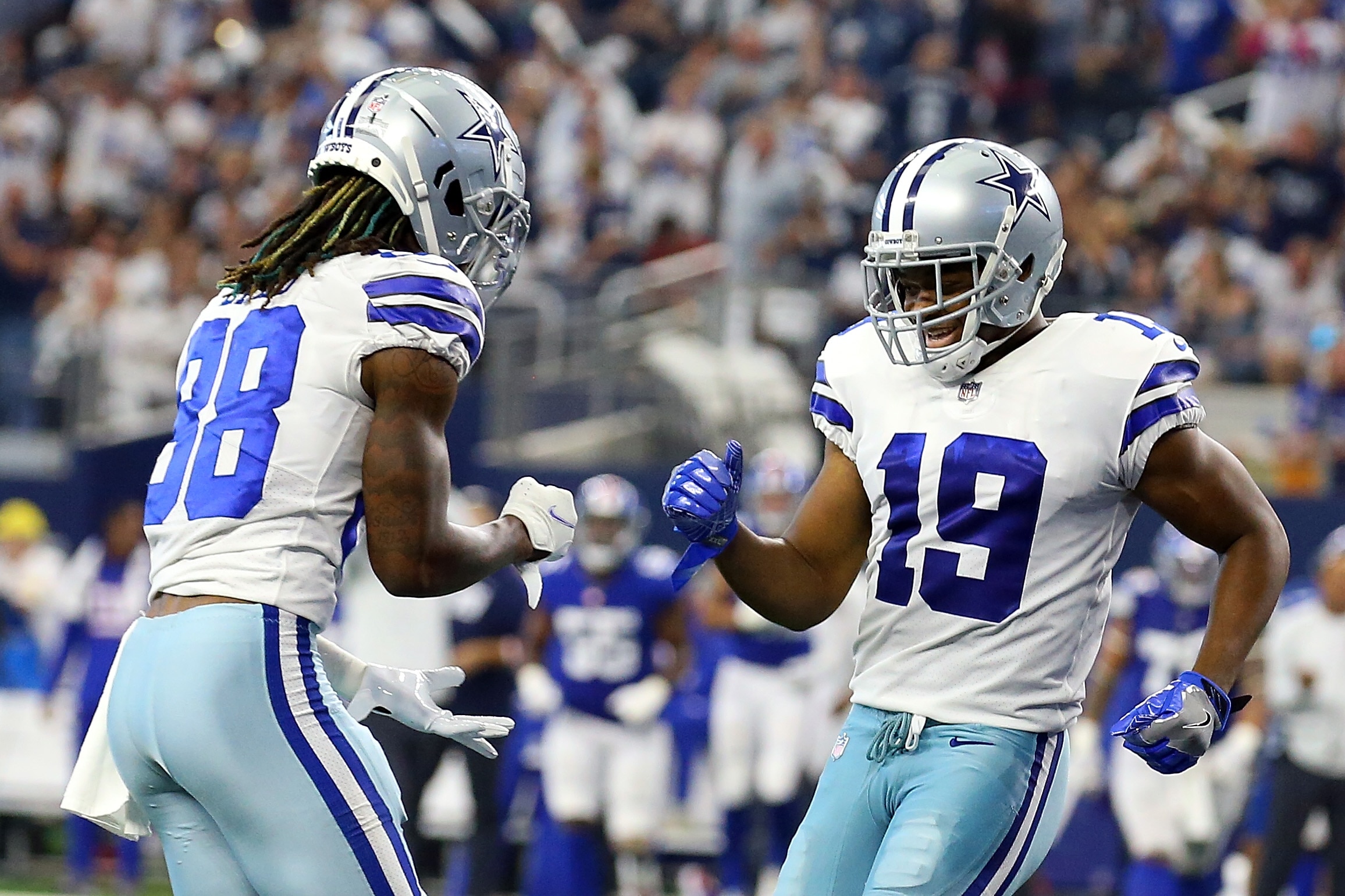 ARLINGTON, TEXAS - OCTOBER 10: CeeDee Lamb #88 of the Dallas Cowboys and Amari Cooper #19 of the Dallas Cowboys celebrate a touchdown against the New York Giants at AT&T Stadium on October 10, 2021 in Arlington, Texas. (Photo by Richard Rodriguez/Getty Images)