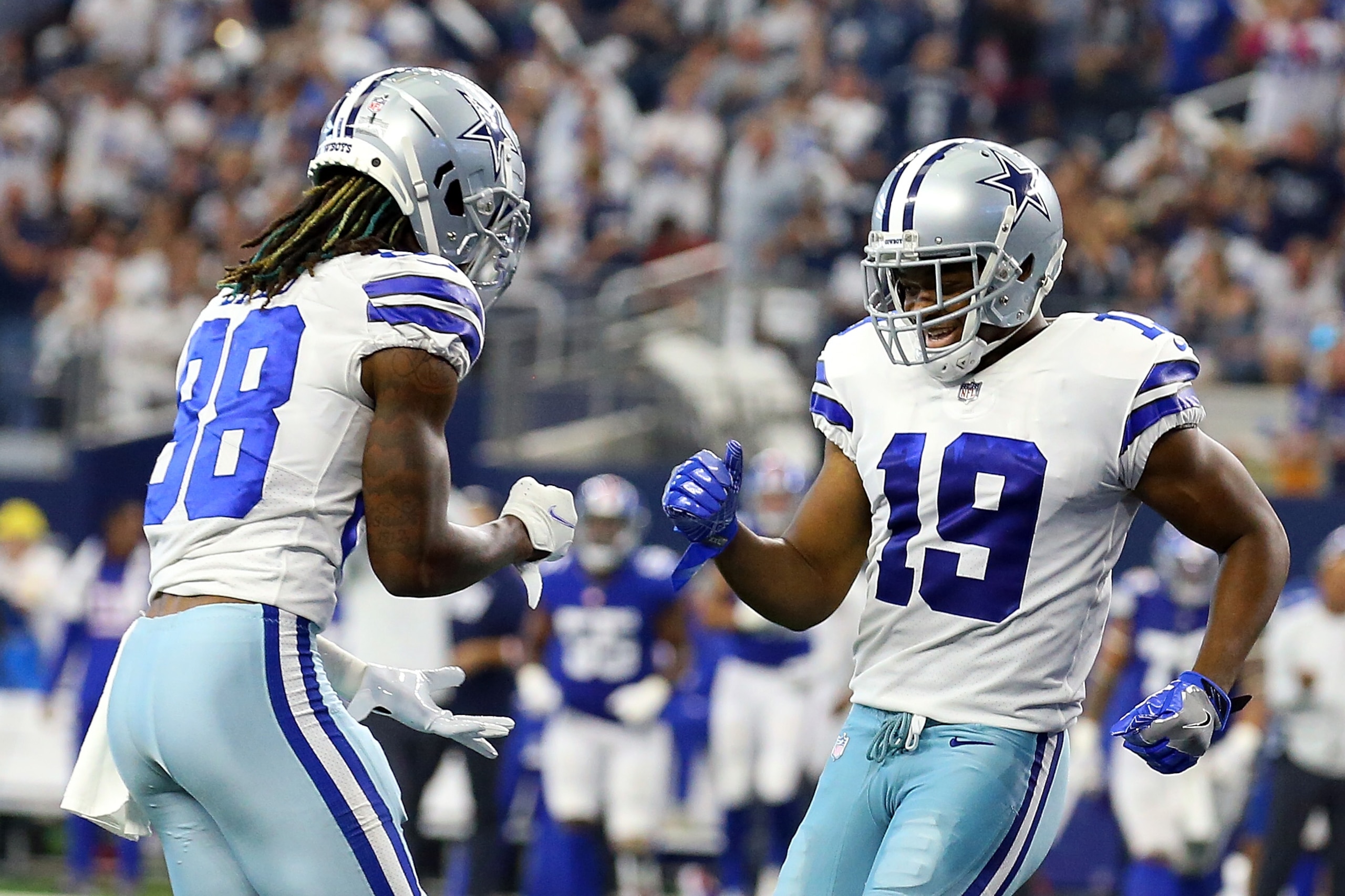 ARLINGTON, TEXAS - OCTOBER 10: CeeDee Lamb #88 of the Dallas Cowboys and Amari Cooper #19 of the Dallas Cowboys celebrate a touchdown against the New York Giants at AT&T Stadium on October 10, 2021 in Arlington, Texas. (Photo by Richard Rodriguez/Getty Images)