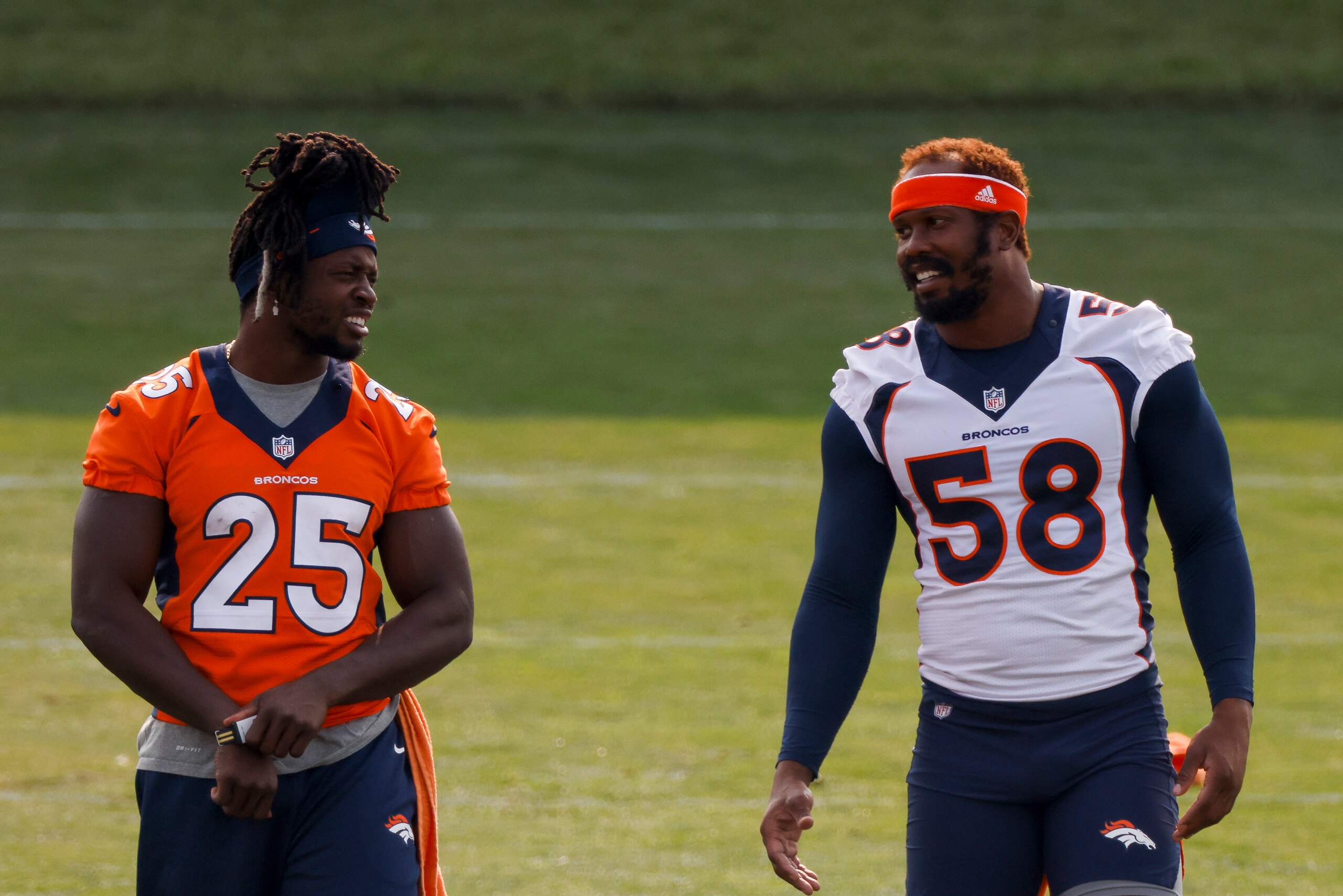 ENGLEWOOD, CO - AUGUST 21:  Running back Melvin Gordon #25 and linebacker Von Miller #58 of the Denver Broncos talk on the field during a training session at UCHealth Training Center on August 21, 2020 in Englewood, Colorado. (Photo by Justin Edmonds/Getty Images)