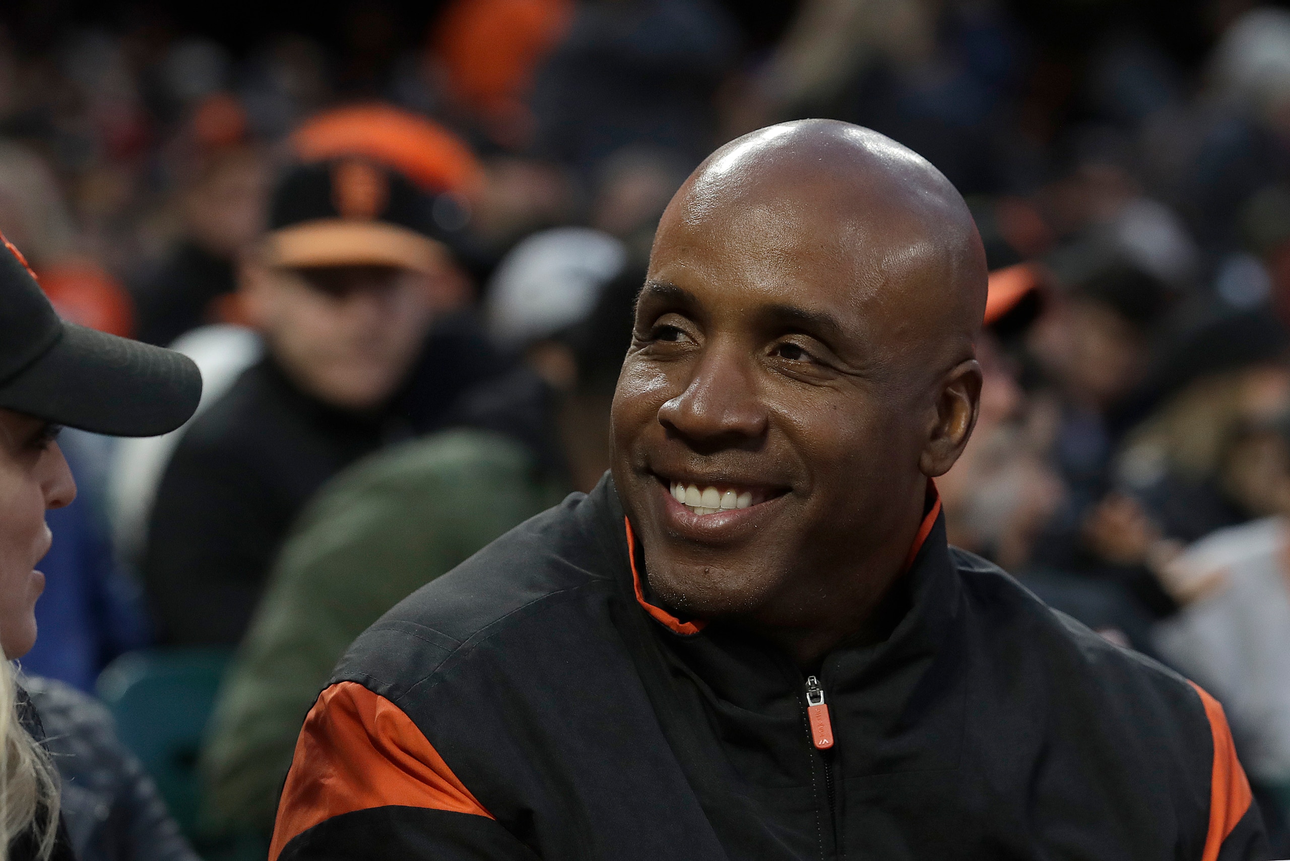 Barry Bonds smiles while watching a baseball game between the San Francisco Giants and the Arizona Diamondbacks in San Francisco, Friday, May 24, 2019. (AP Photo/Jeff Chiu)