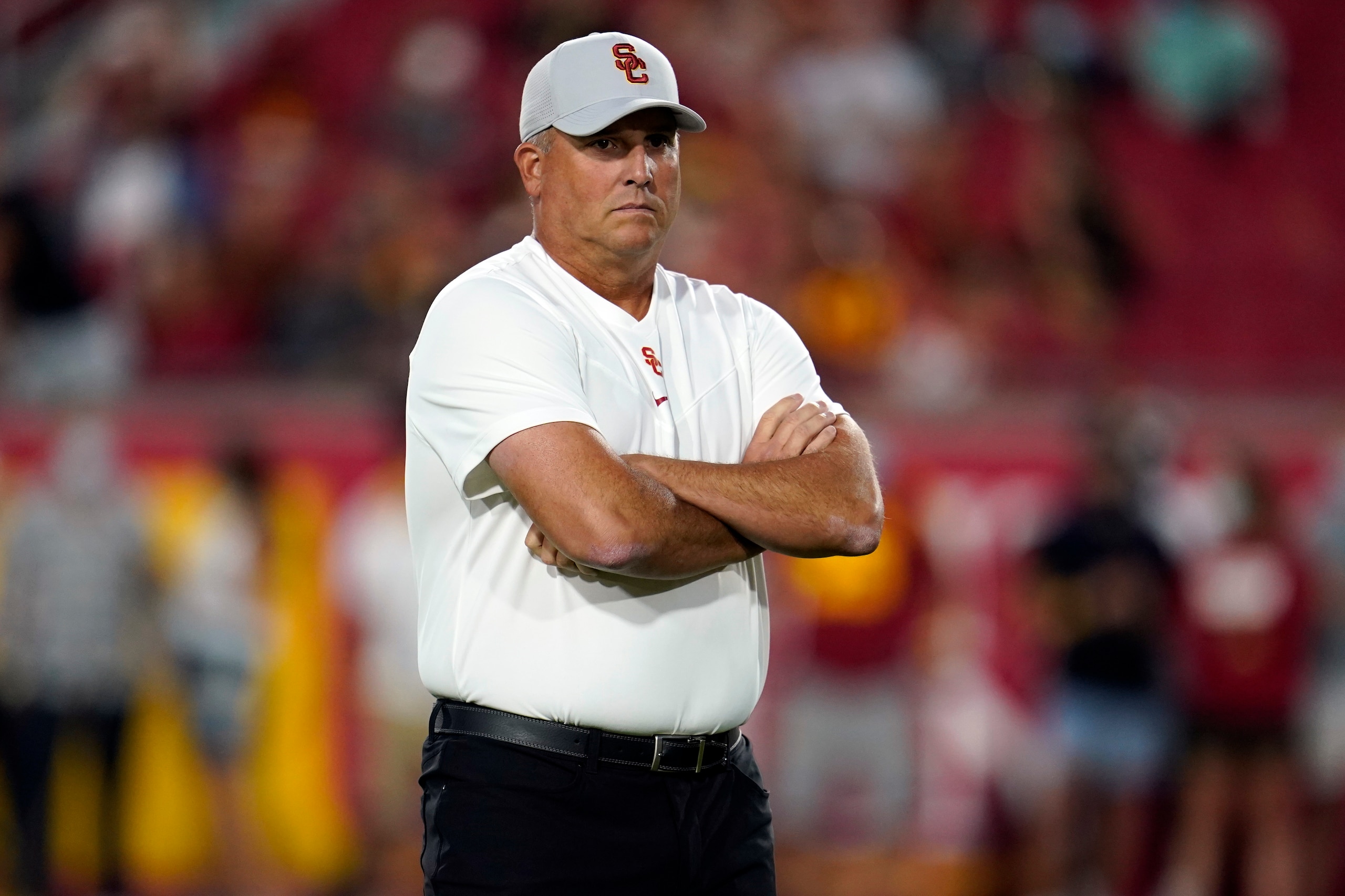 Southern California head coach Clay Helton watches warm ups on the field before an NCAA college football game against Stanford Saturday, Sept. 11, 2021, in Los Angeles. (AP Photo/Marcio Jose Sanchez)