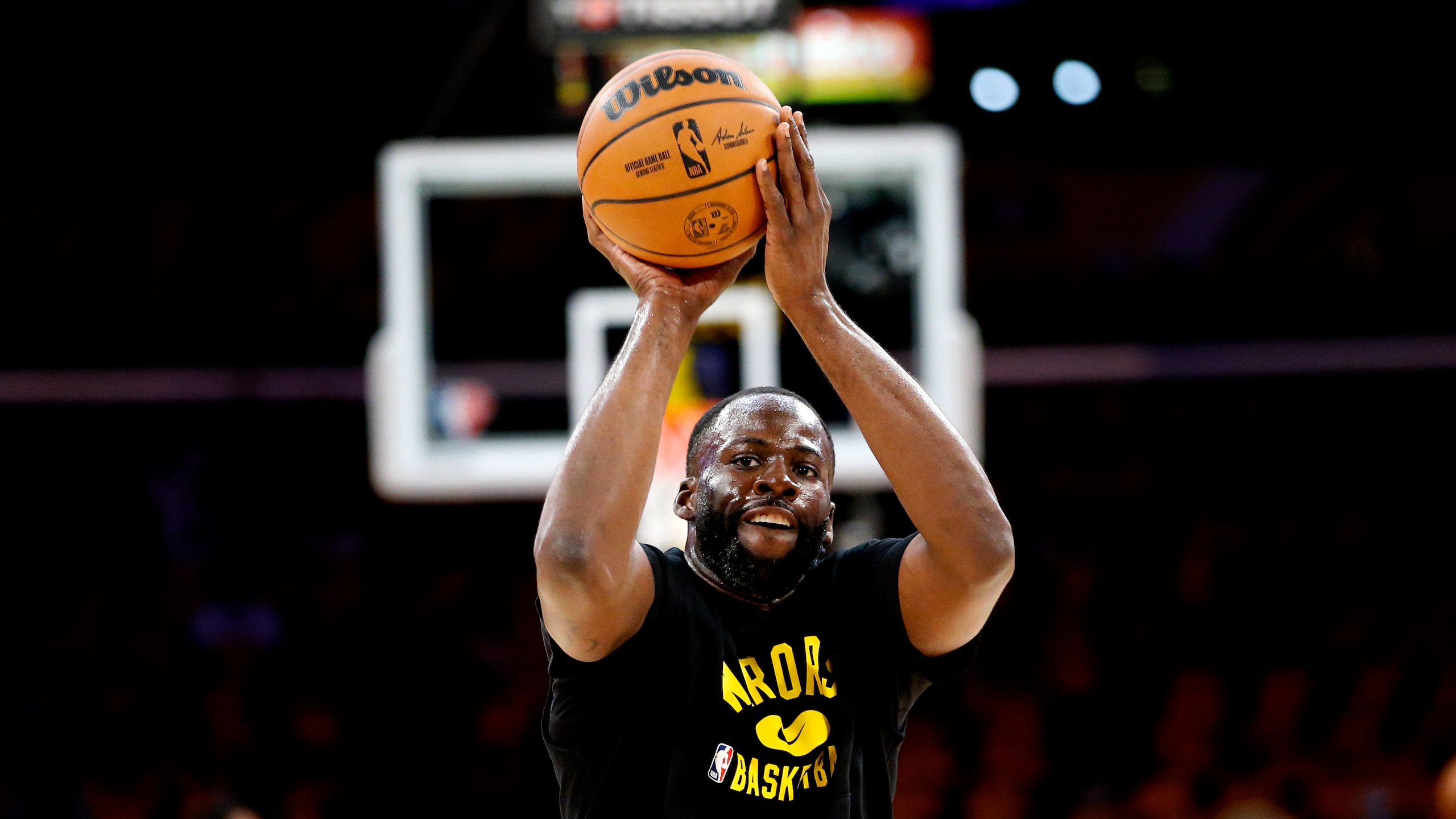 Golden State Warriors forward Draymond Green (23) warms up before an NBA basketball game against the Los Angeles Lakers in Los Angeles, Tuesday, Oct. 19, 2021. (AP Photo/Ringo H.W. Chiu)