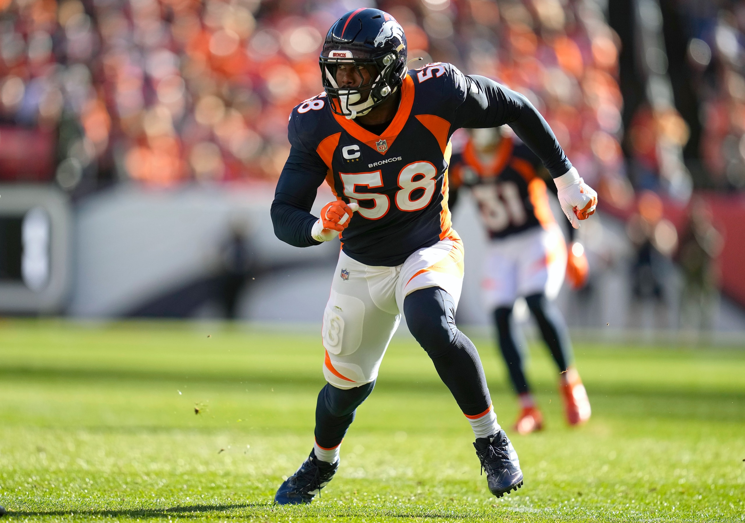 FILE - Denver Broncos outside linebacker Von Miller (58) plays against the Las Vegas Raiders during the first half of an NFL football game, Sunday, Oct. 17, 2021, in Denver. A person with knowledge of the deal tells The Associated Press, Monday, Nov. 1, 2021,  that the Denver Broncos have agreed to trade star linebacker Von Miller to the Los Angeles Rams for a pair of 2022 draft picks. (AP Photo/Jack Dempsey, File)