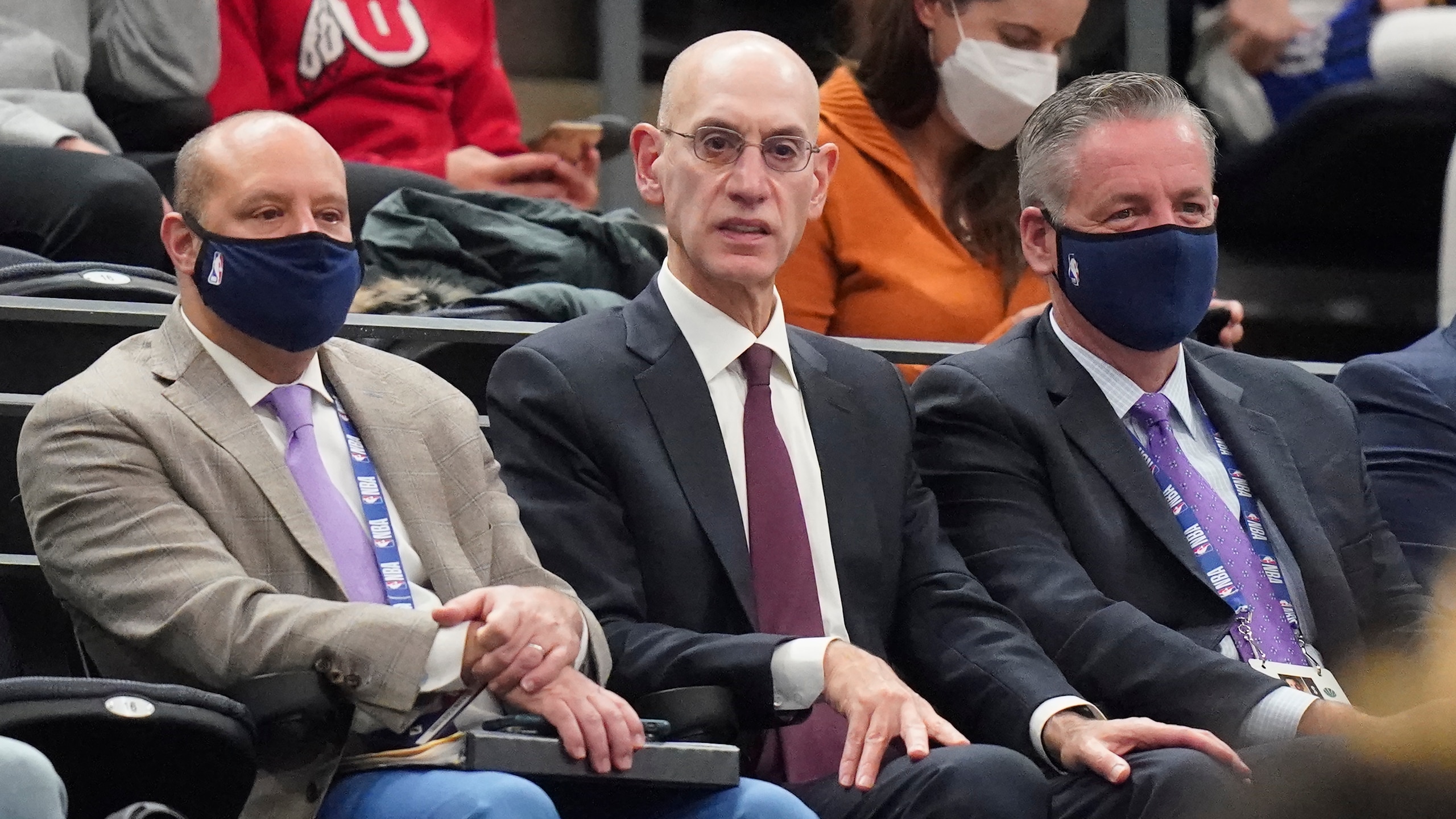 NBA Commissioner Adam Silver, center, looks on in the second half during an NBA basketball game between the Utah Jazz and the Oklahoma City Thunder on Wednesday, Oct. 20, 2021, in Salt Lake City. (AP Photo/Rick Bowmer)