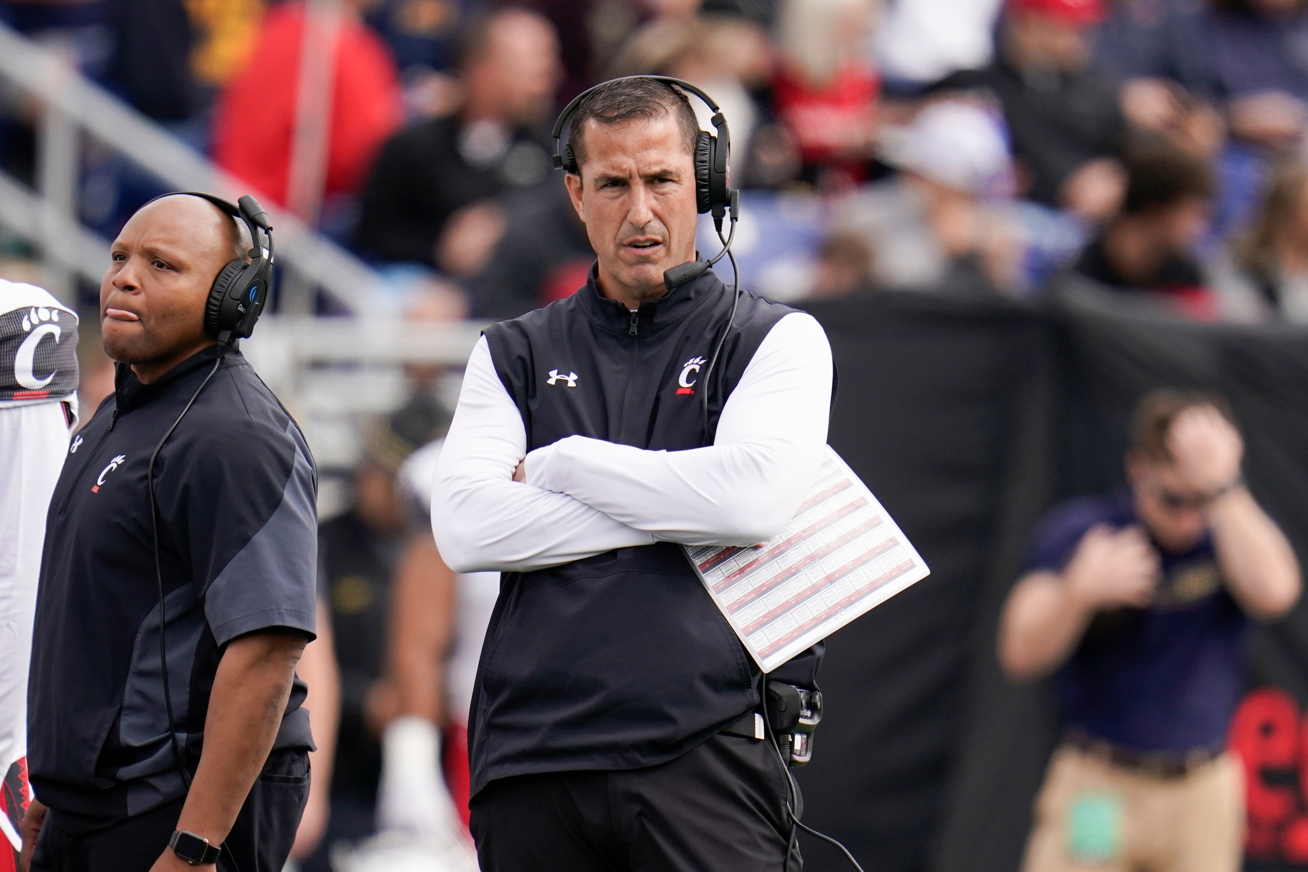 Cincinnati head coach Luke Fickell looks on during the first half of an NCAA college football game against Navy, Saturday, Oct. 23, 2021, in Annapolis, Md. (AP Photo/Julio Cortez)