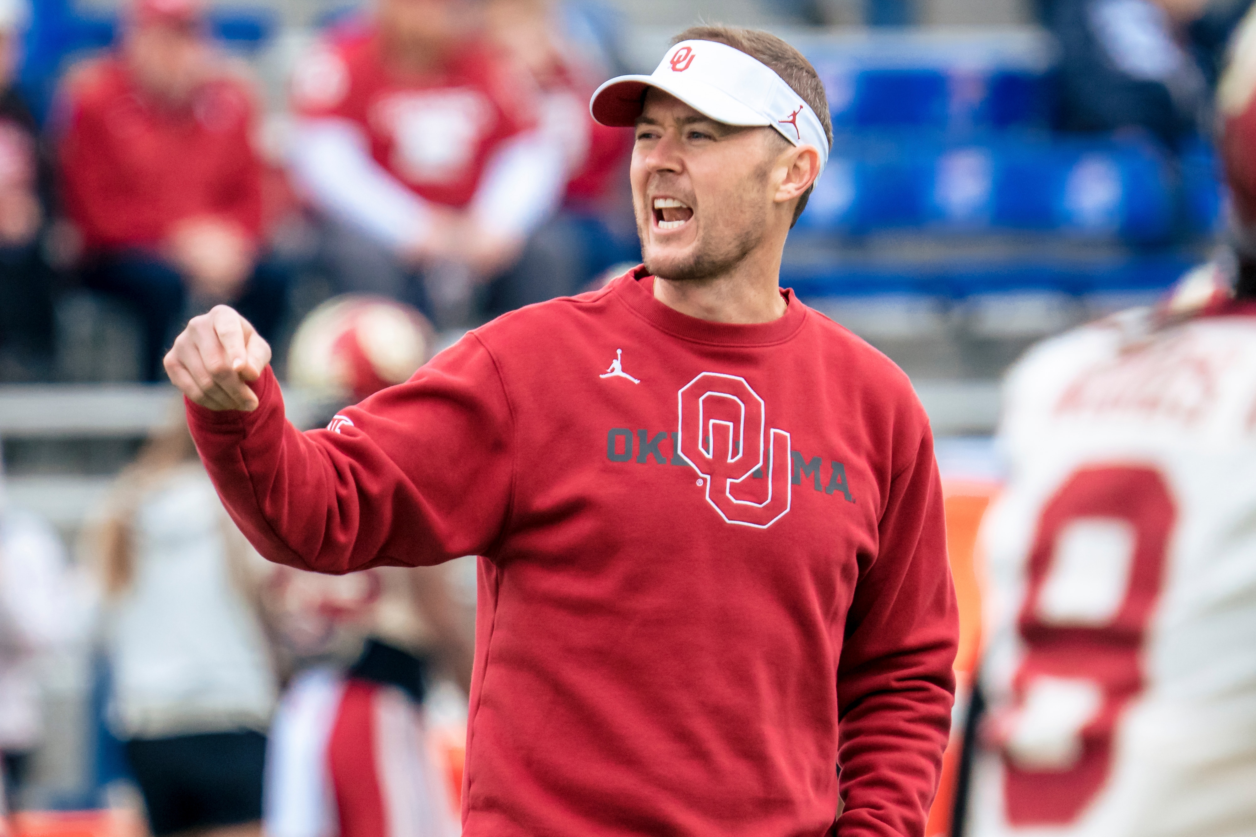 LAWRENCE, KS - OCTOBER 23: Head coach Lincoln Riley of the Oklahoma Sooners talks to players during warmups before a game against the Kansas Jayhawks at David Booth Kansas Memorial Stadium on October 23, 2021 in Lawrence, Kansas. (Photo by Kyle Rivas/Getty Images) LAWRENCE, KS - OCTOBER 23: Head coach Lincoln Riley of the Oklahoma Sooners talks to players during warmups before a game against the Kansas Jayhawks at David Booth Kansas Memorial Stadium on October 23, 2021 in Lawrence, Kansas. (Photo by Kyle Rivas/Getty Images)