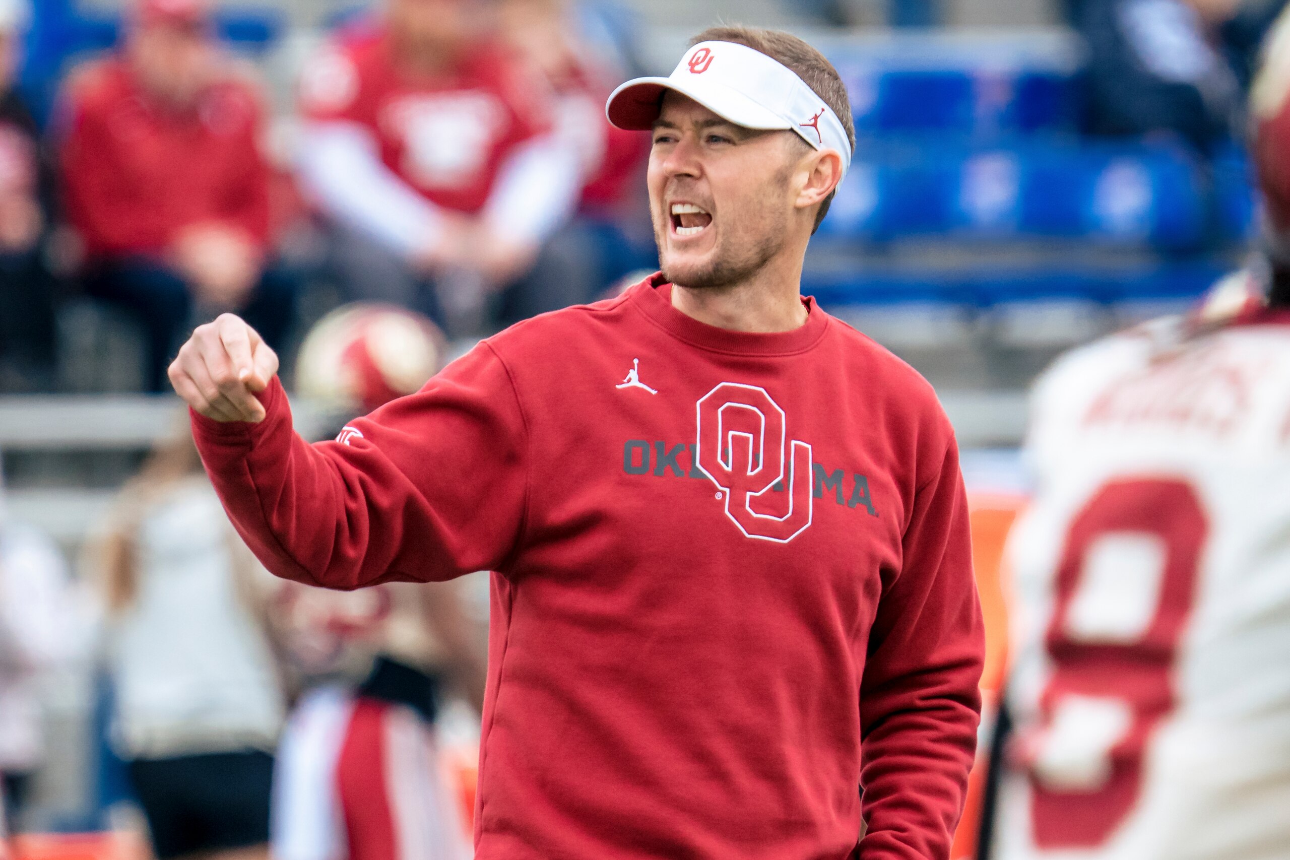 LAWRENCE, KS - OCTOBER 23: Head coach Lincoln Riley of the Oklahoma Sooners talks to players during warmups before a game against the Kansas Jayhawks at David Booth Kansas Memorial Stadium on October 23, 2021 in Lawrence, Kansas. (Photo by Kyle Rivas/Getty Images)