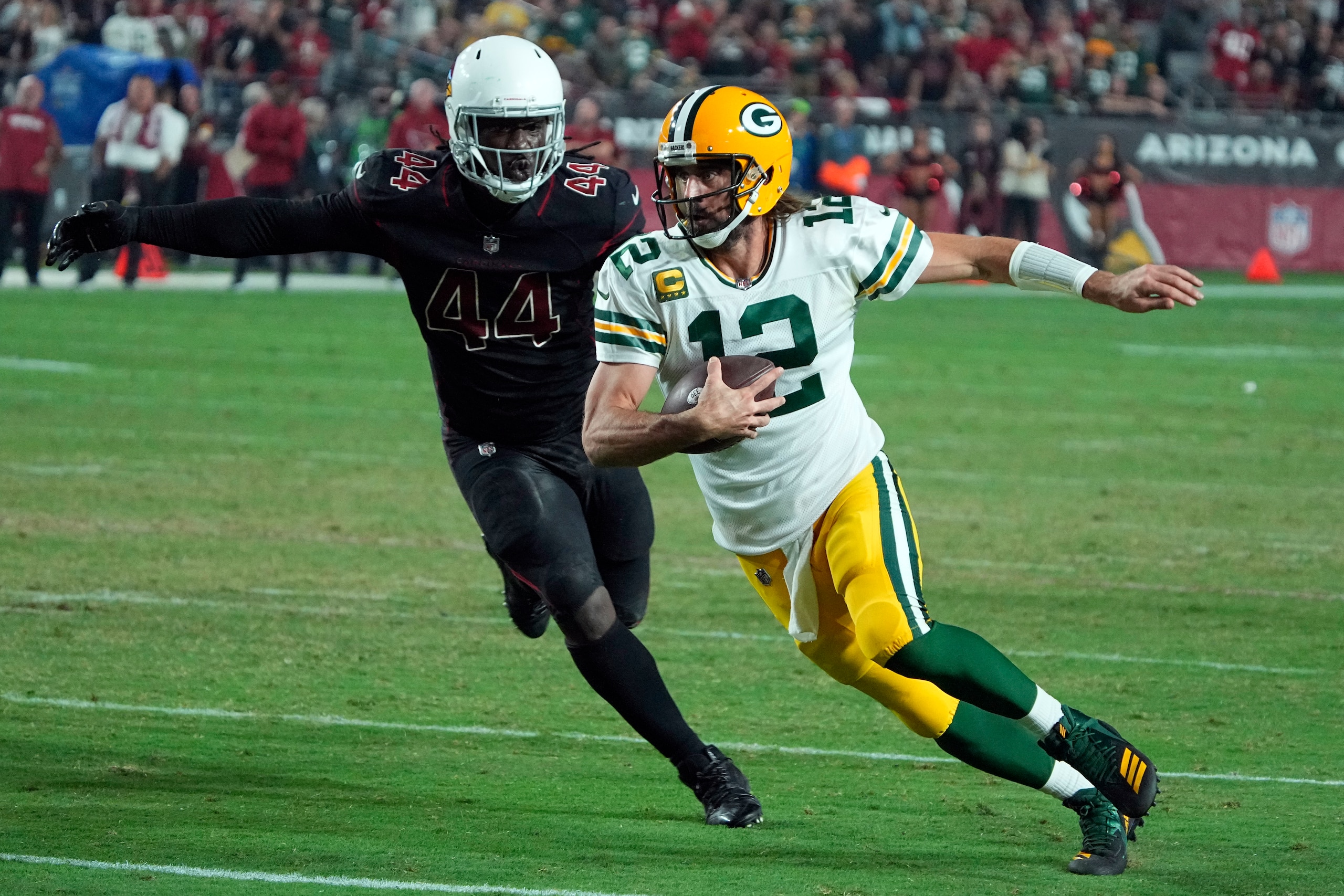 Green Bay Packers quarterback Aaron Rodgers (12) during the first half of an NFL football game against the Arizona Cardinals, Thursday, Oct. 28, 2021, in Glendale, Ariz. (AP Photo/Rick Scuteri)