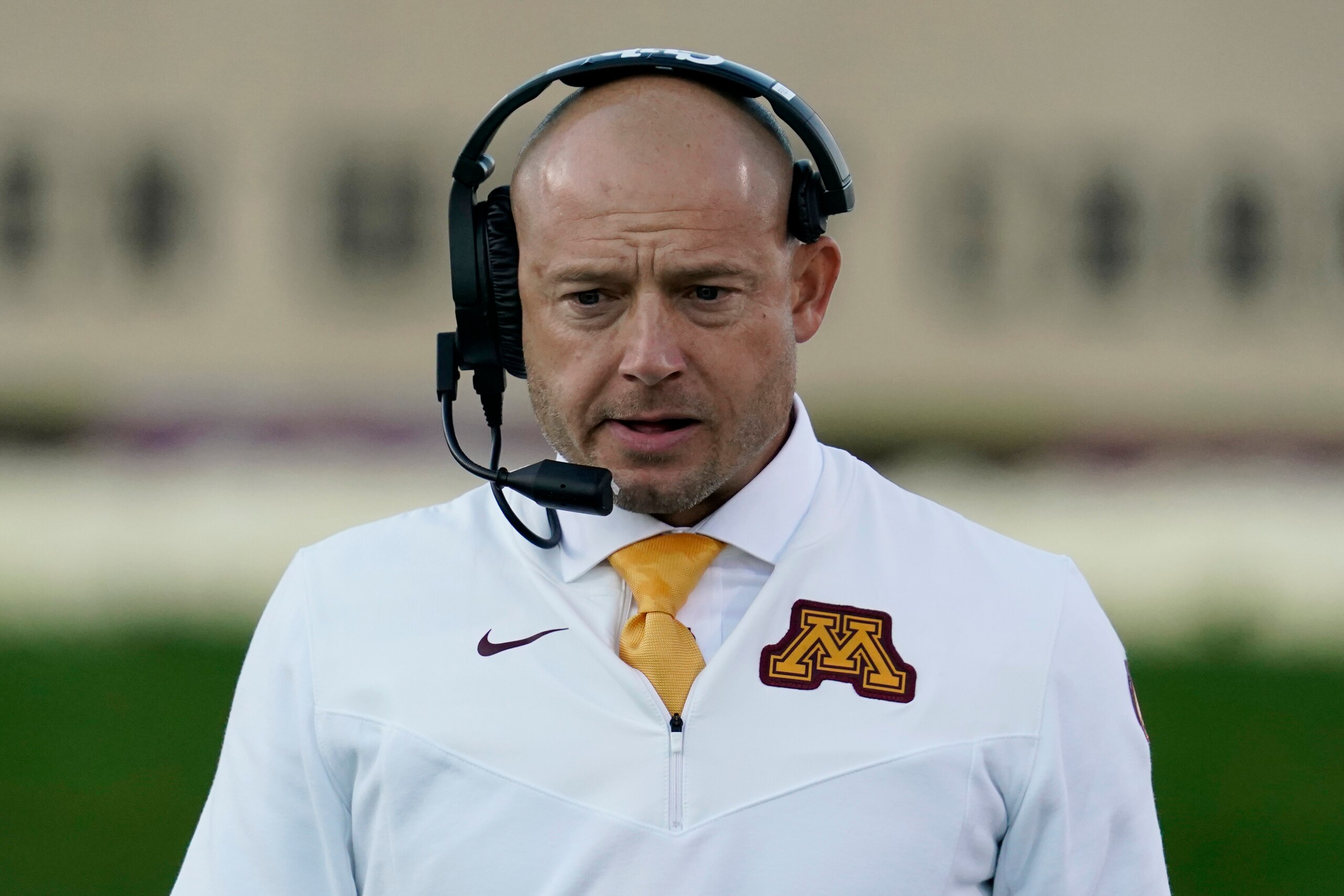 Minnesota head coach P.J. Fleck talks on the radio during the second half of an NCAA college football game against Northwestern in Evanston, Ill., Saturday, Oct. 30, 2021. (AP Photo/Nam Y. Huh) Minnesota head coach P.J. Fleck talks on the radio during the second half of an NCAA college football game against Northwestern in Evanston, Ill., Saturday, Oct. 30, 2021. (AP Photo/Nam Y. Huh)