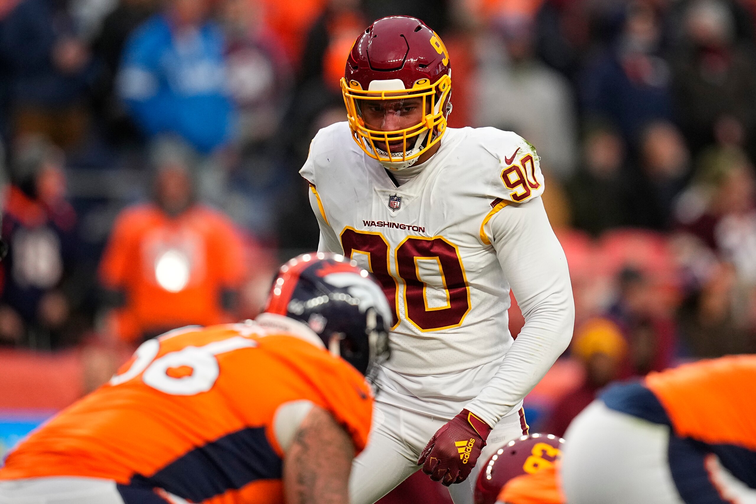 Washington Football Team defensive end Montez Sweat (90) lines up against the Denver Broncos during an NFL football game Sunday, Oct. 31, 2021, in Denver. (AP Photo/Jack Dempsey)