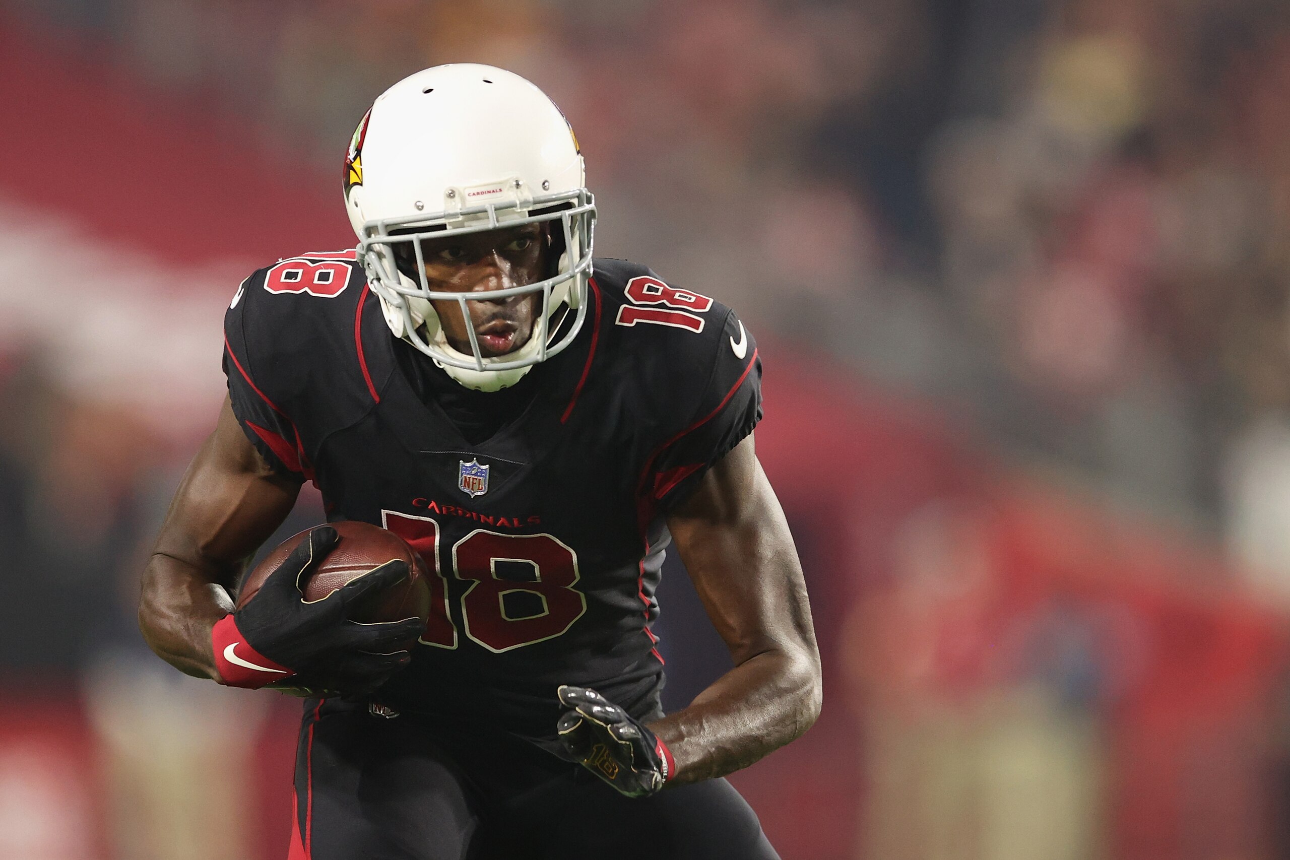 GLENDALE, ARIZONA - OCTOBER 28: Wide receiver A.J. Green #18 of the Arizona Cardinals carries the football after a reception during the second half of the NFL game at State Farm Stadium on October 28, 2021 in Glendale, Arizona. The Packers defeated the Cardinals 24-21.  (Photo by Christian Petersen/Getty Images)