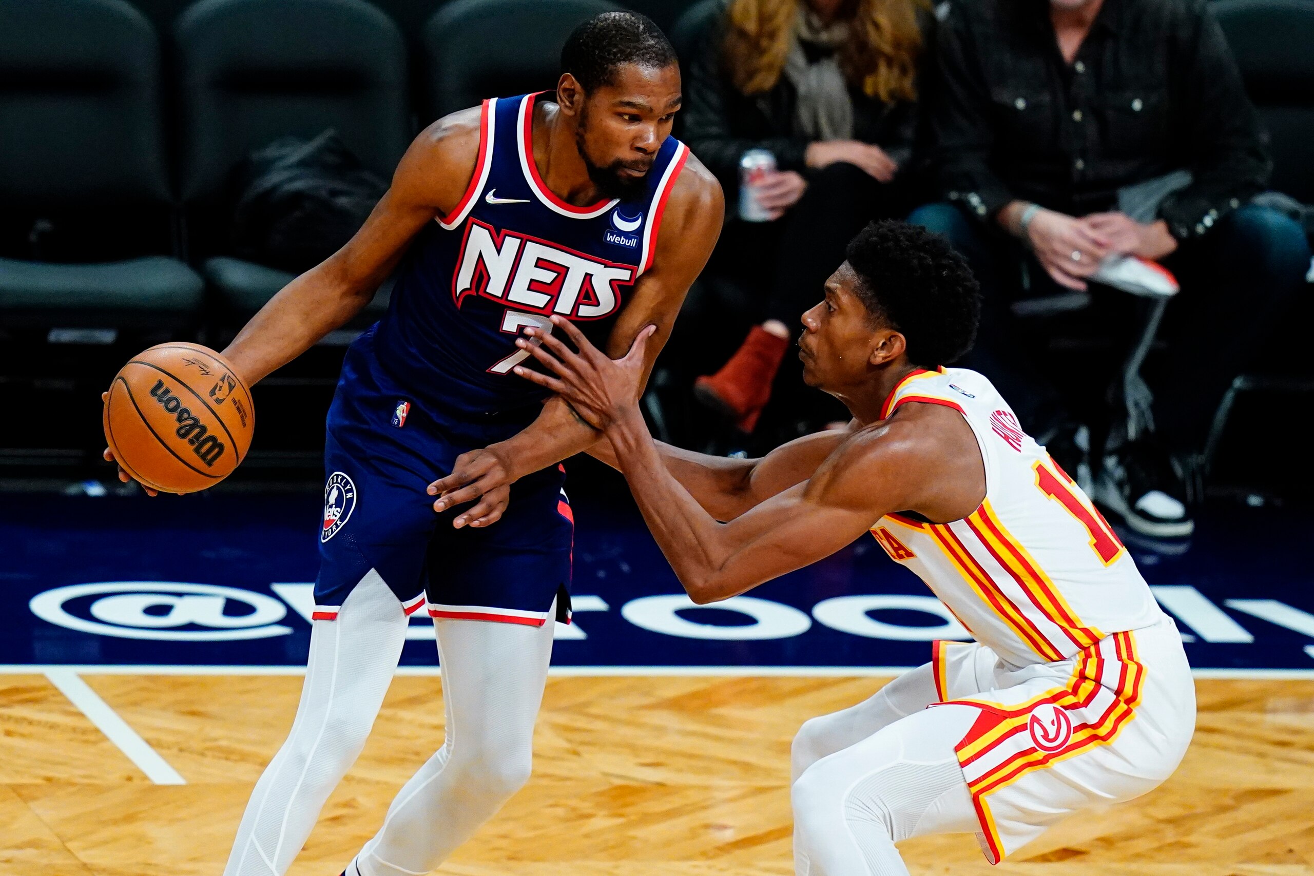 Atlanta Hawks' De'Andre Hunter, right, defends Brooklyn Nets' Kevin Durant during the second half of an NBA basketball game Wednesday, Nov. 3, 2021, in New York. (AP Photo/Frank Franklin II)