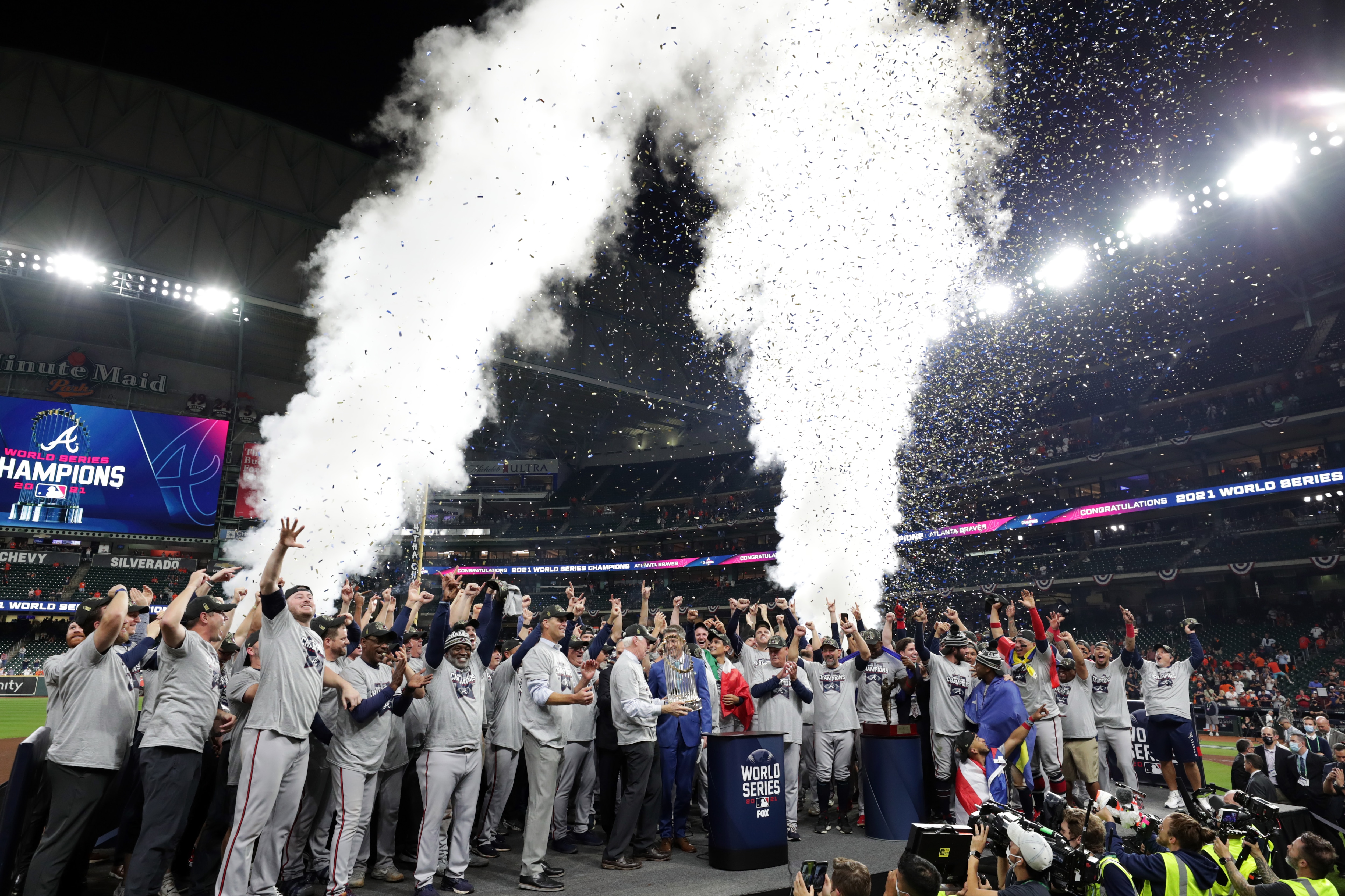 HOUSTON, TX - NOVEMBER 02: Members of the Atlanta Braves, ownership, staff and commissioner of baseball Robert D. Manfred Jr. celebrate after the Braves beat the Astros, 7-0, in Game 6 of the 2021 World Series between the Atlanta Braves and the Houston Astros at Minute Maid Park on Tuesday, November 2, 2021 in Houston, Texas. (Photo by Mary DeCicco/MLB Photos via Getty Images)
