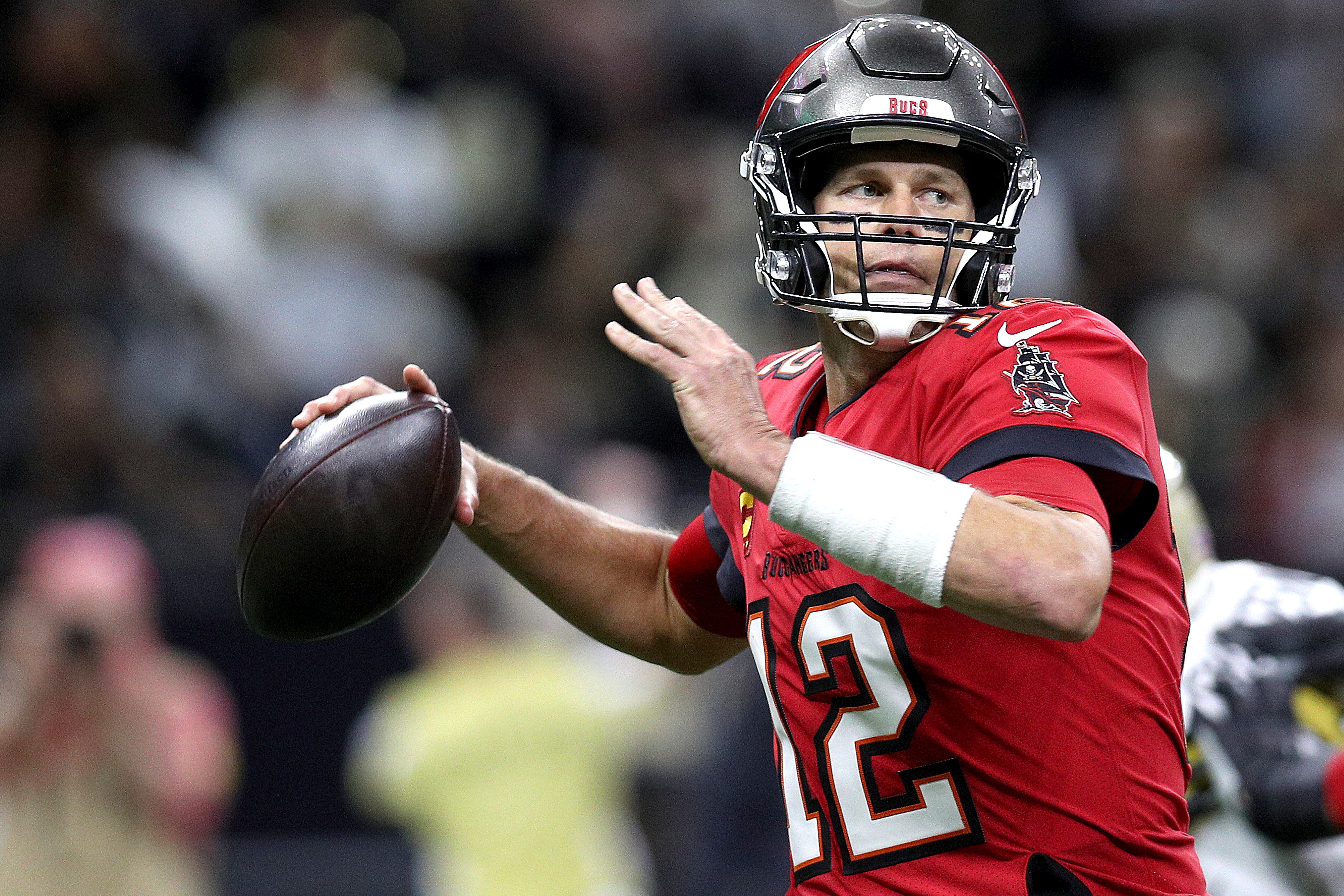 NEW ORLEANS, LOUISIANA - OCTOBER 31: Tom Brady #12 of the Tampa Bay Buccaneers looks to pass during a NFL game against the New Orleans Saints at Caesars Superdome on October 31, 2021 in New Orleans, Louisiana. (Photo by Sean Gardner/Getty Images)
