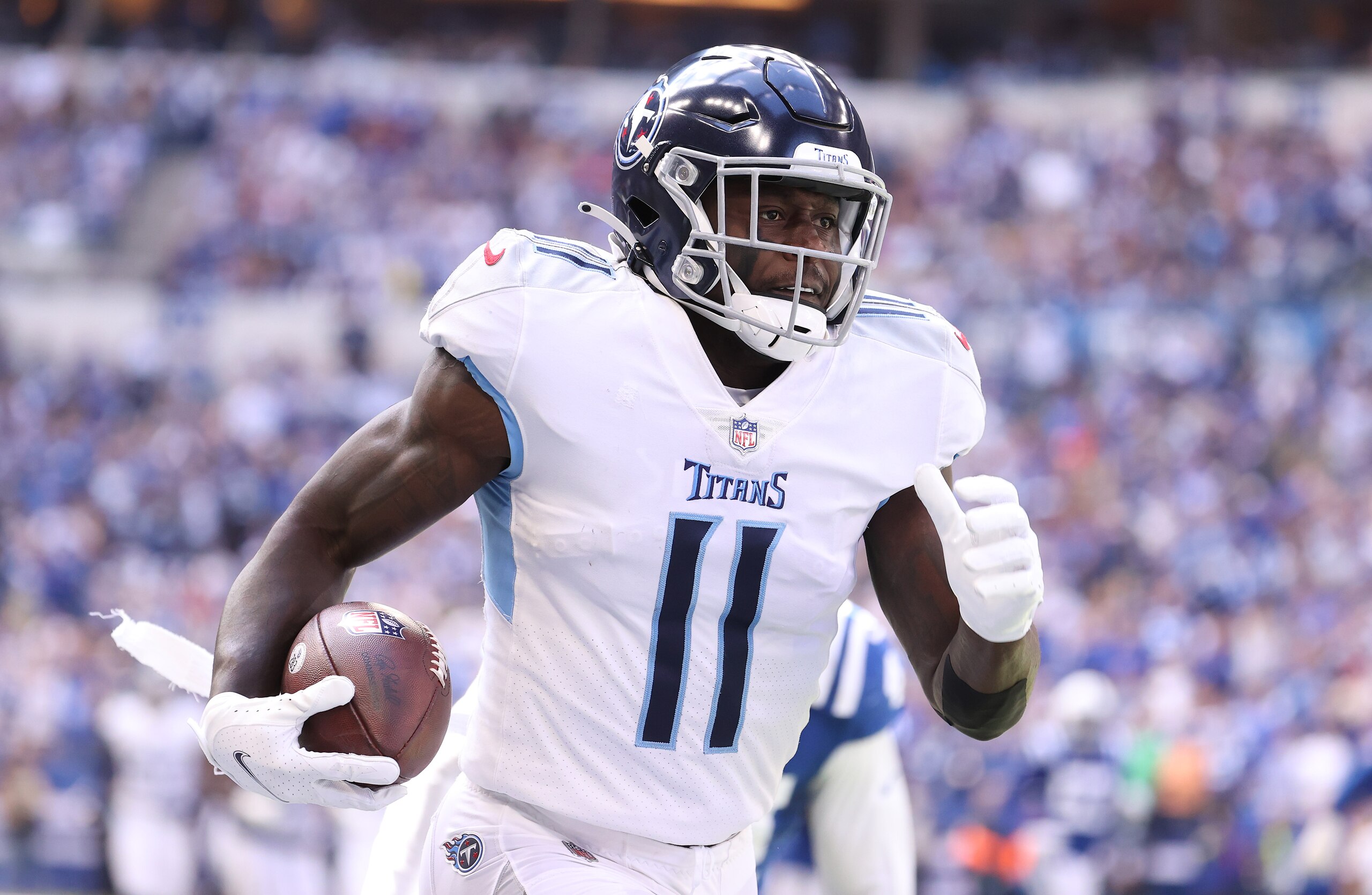INDIANAPOLIS, INDIANA - OCTOBER 31:   A.J. Brown #11of the Tennessee Titans runs for a touchdown against the Indianapolis Colts at Lucas Oil Stadium on October 31, 2021 in Indianapolis, Indiana. (Photo by Andy Lyons/Getty Images)