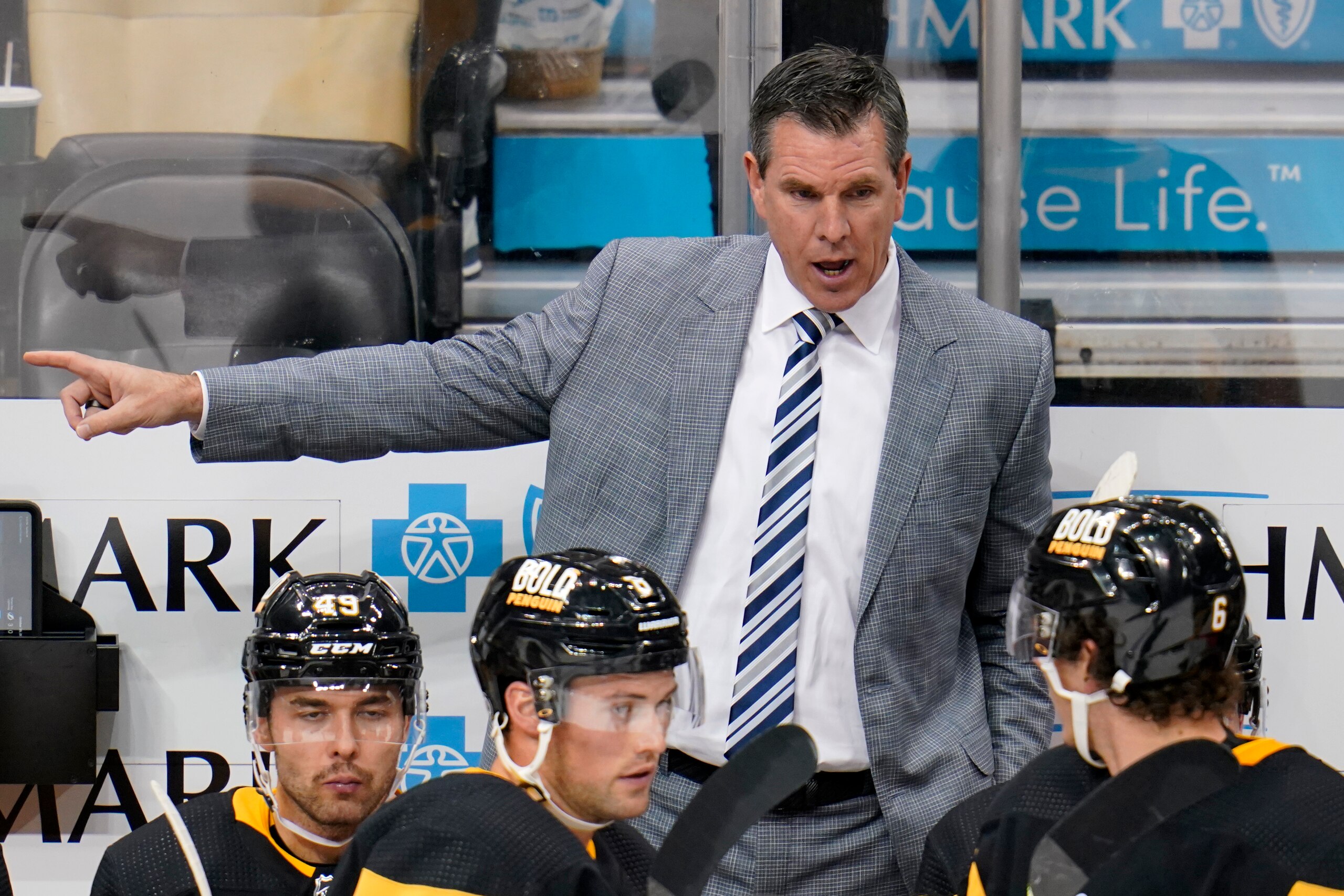 Pittsburgh Penguins head coach Mike Sullivan gives instructions during the first period of an NHL hockey game against the Tampa Bay Lightning in Pittsburgh, Tuesday, Oct. 26, 2021. The Lightning won 5-1. (AP Photo/Gene J. Puskar)